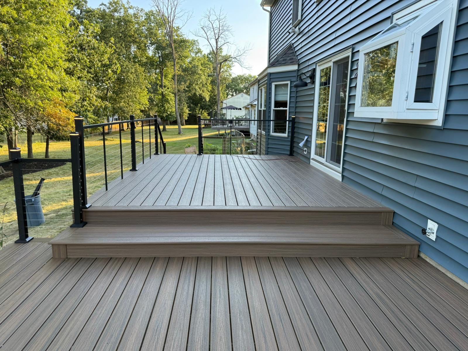 Deck resurface with Trex and cable rails by deck guardian
