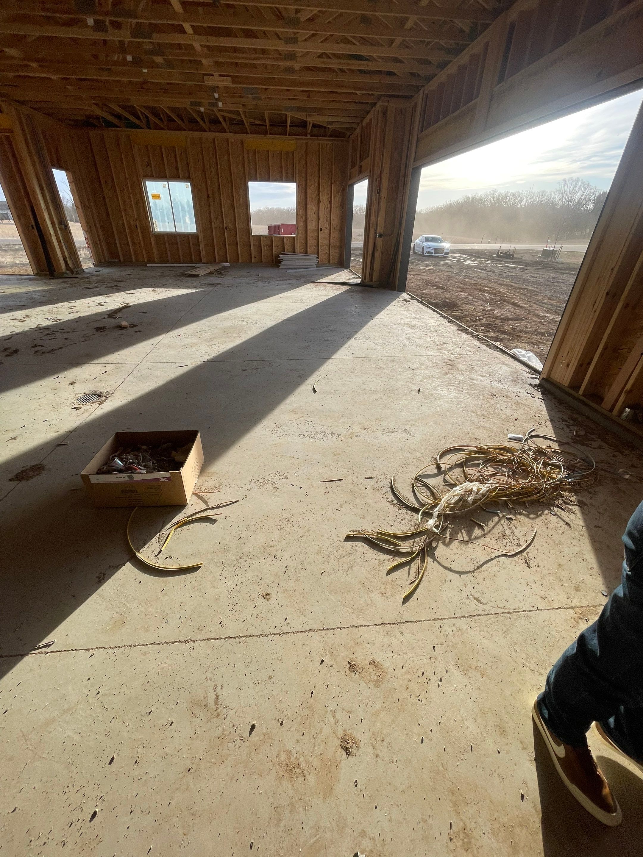 Multi-Bay Garage Concrete Coating and Floor Refinishing in South Dakota by Select Painting, Coatings & Garage Cabinets