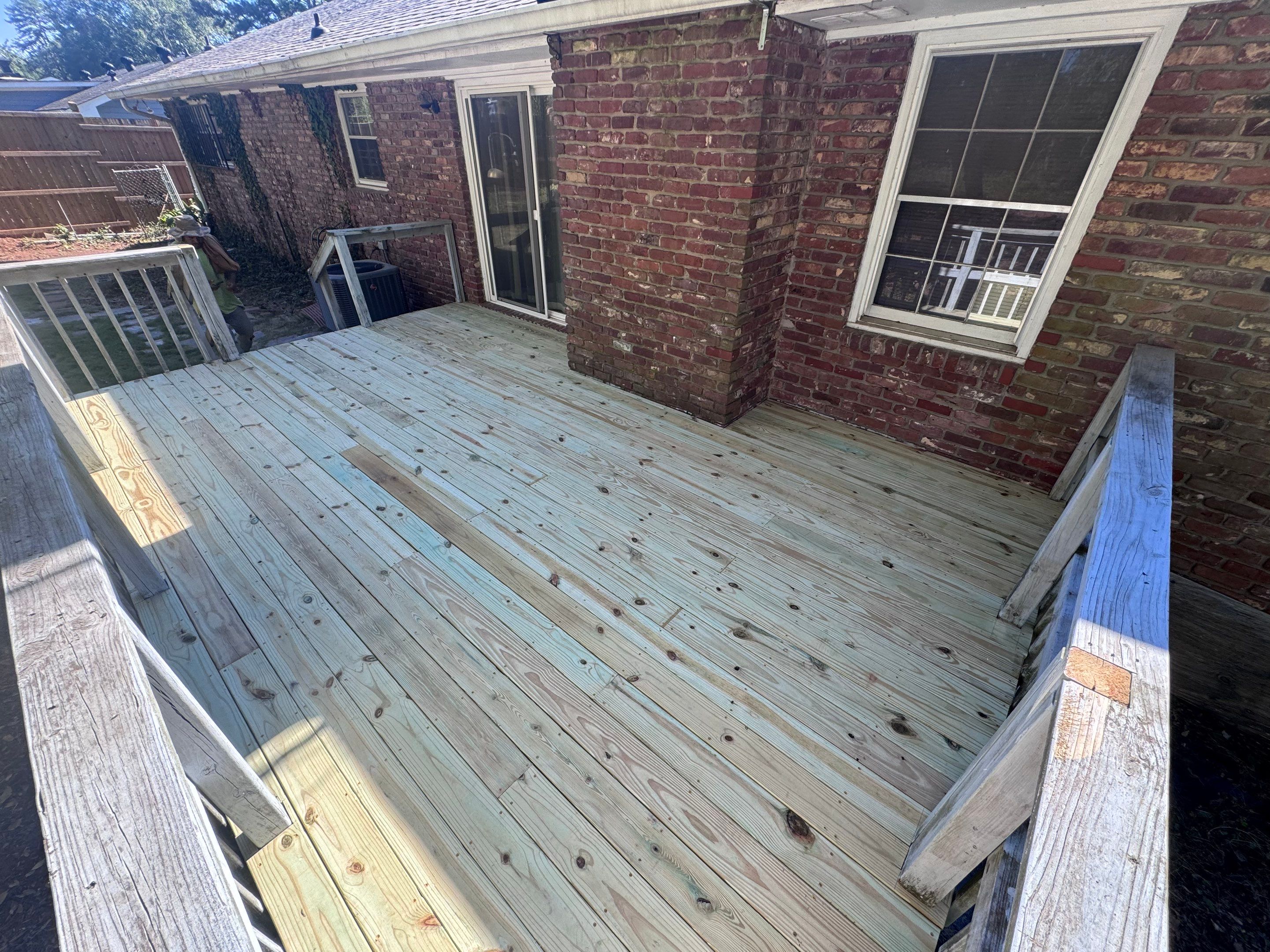 Pressure-Treated Wood Deck Replacement and Railing Installation in Marietta by Swift Home Renovations 