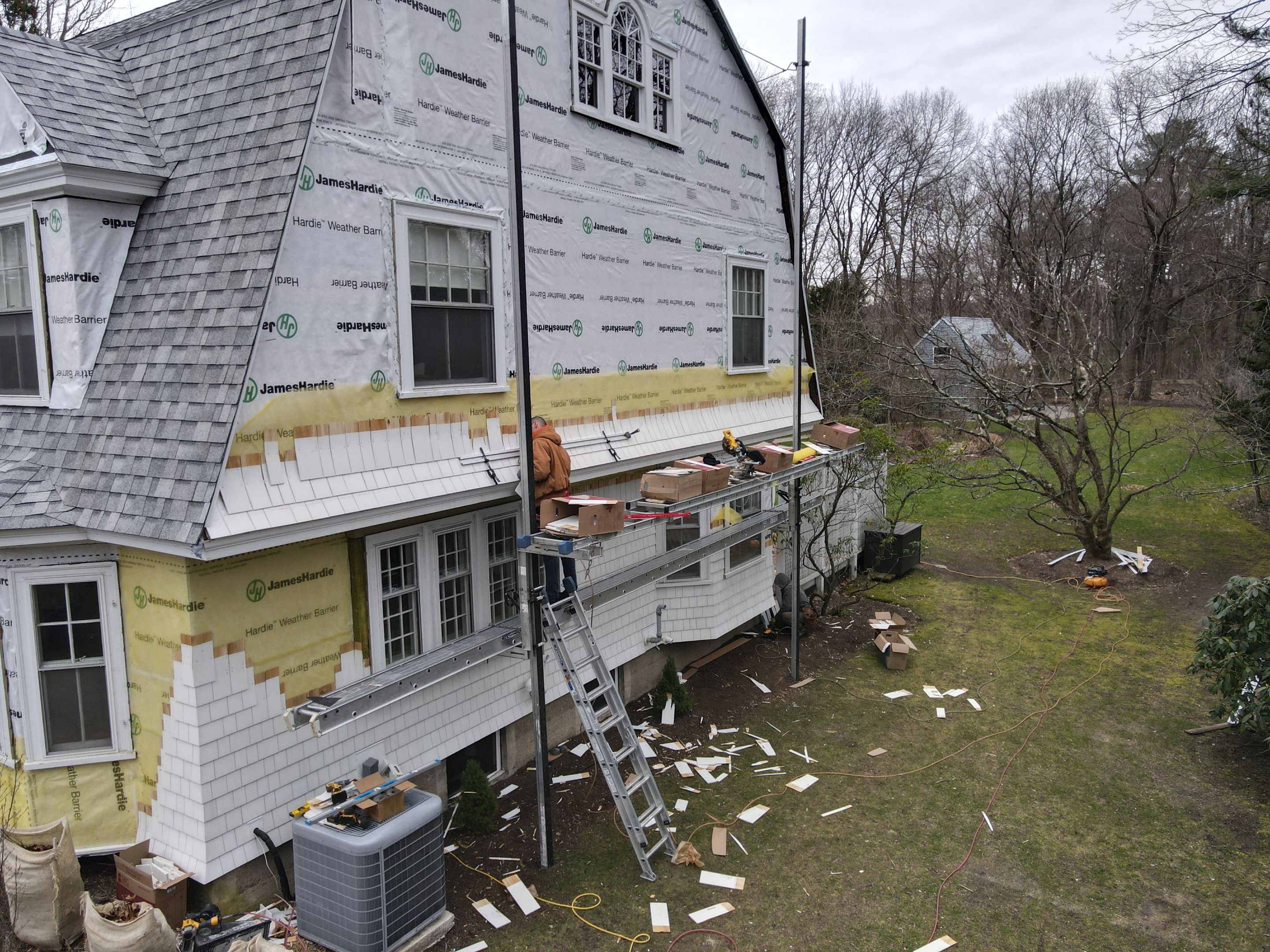 White cedar shingles and windows in Wayland, MA by UBrothers Construction