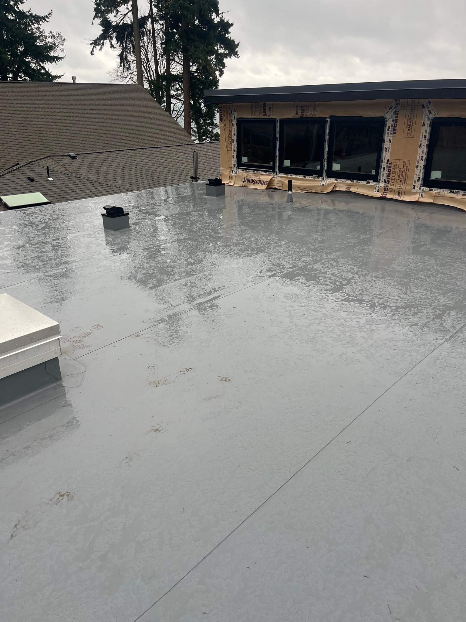 New Construction Roof Installation in Indianola, WA by Hanley Construction