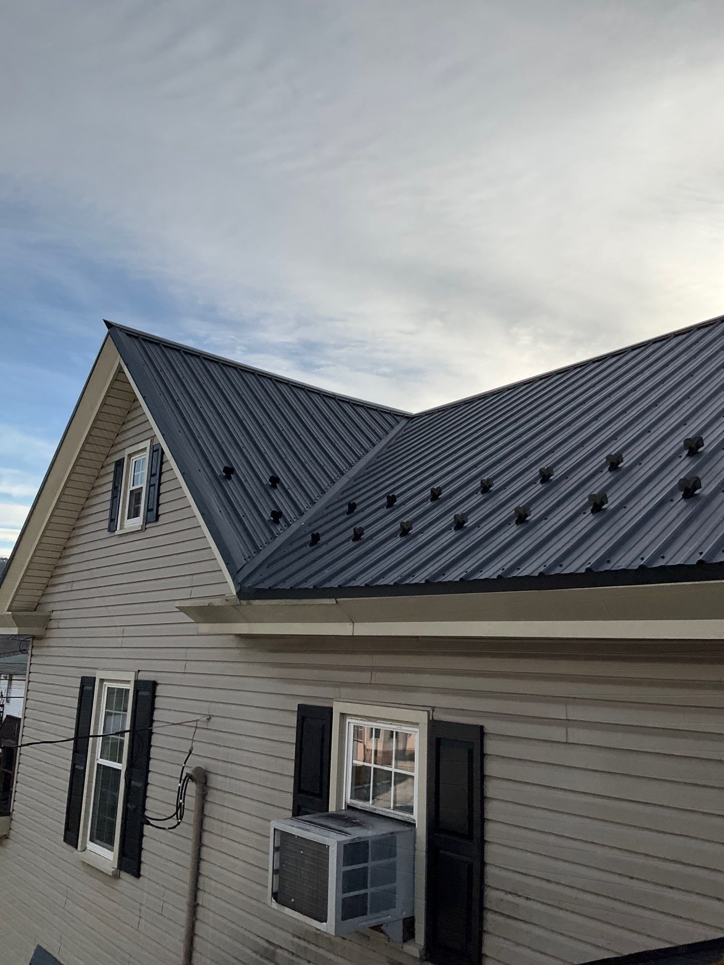Textured Black Meal Roof by Esh Builders