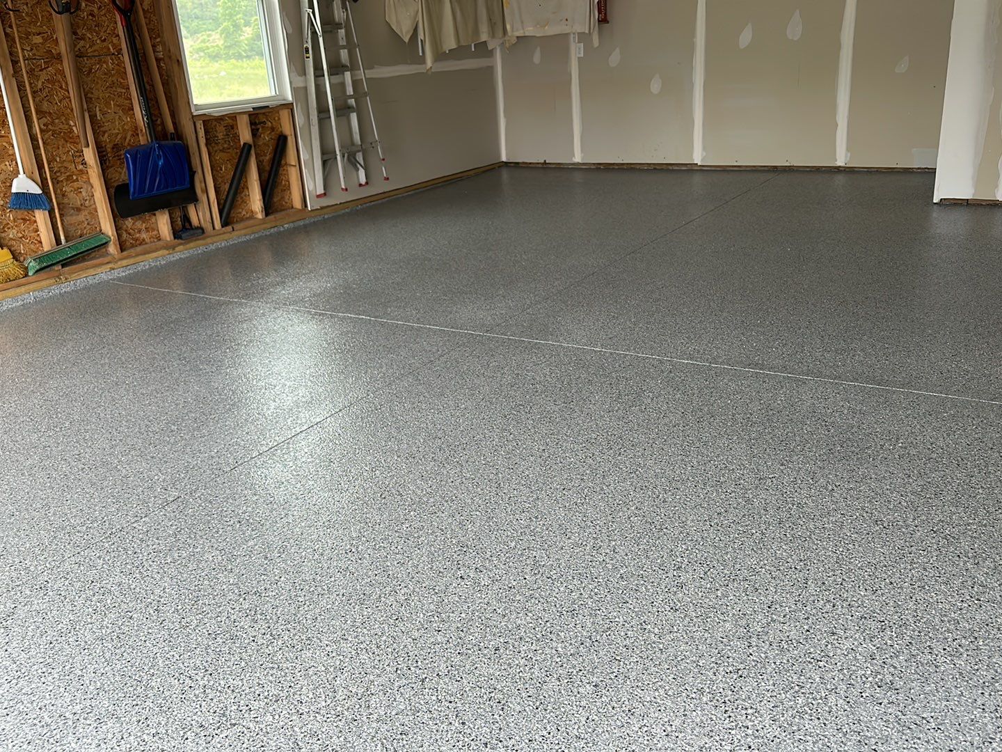 Silverado garage floor coating  by NG Masonry & Construction LLC