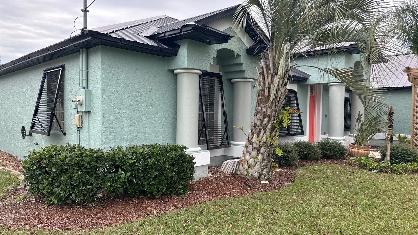 Bahama Shutters in Jet Black by Smart Guard Shutters