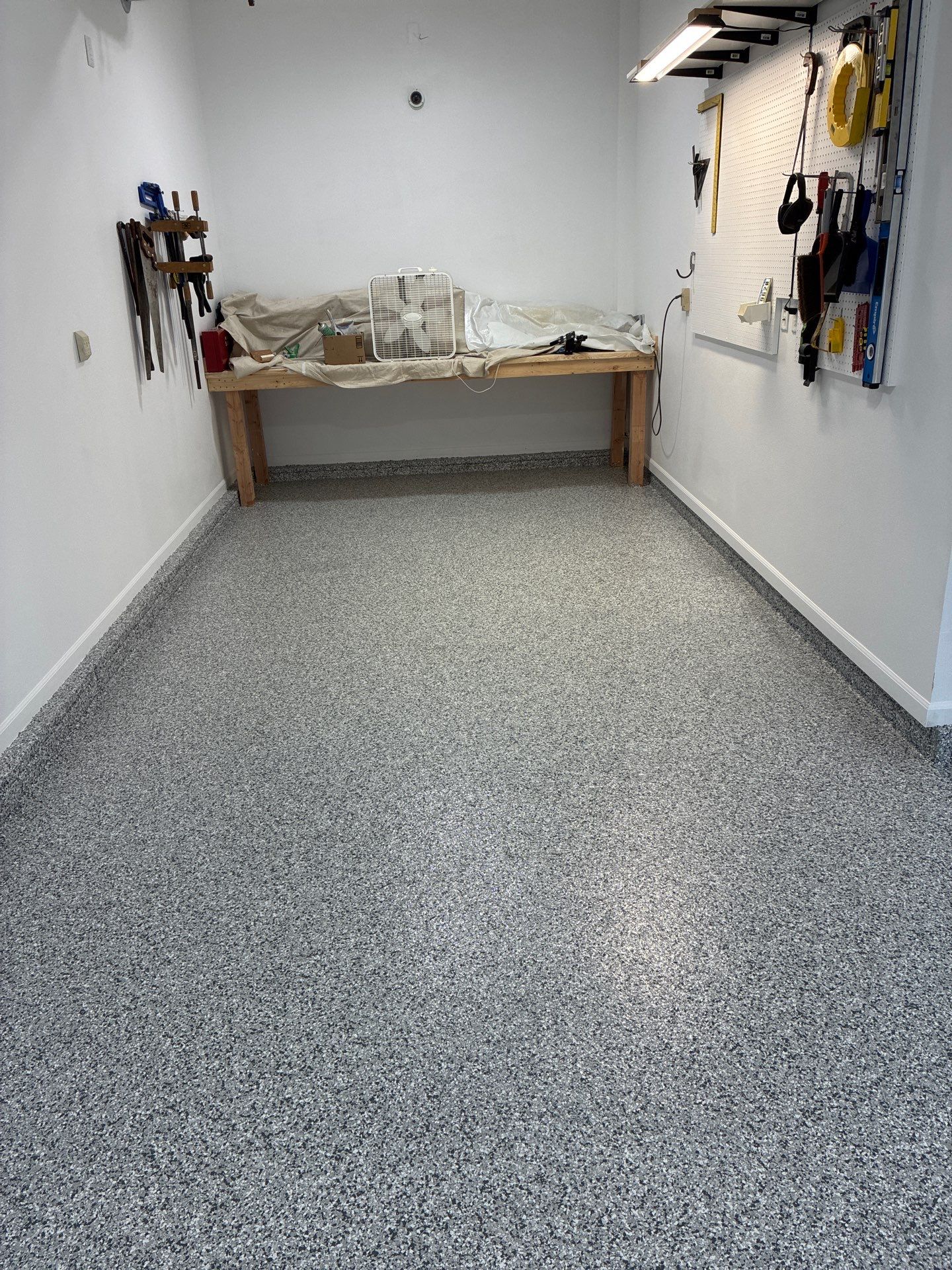Gray Speckled Epoxy Garage Floor Coating in Grimes by Revival Concrete Coatings