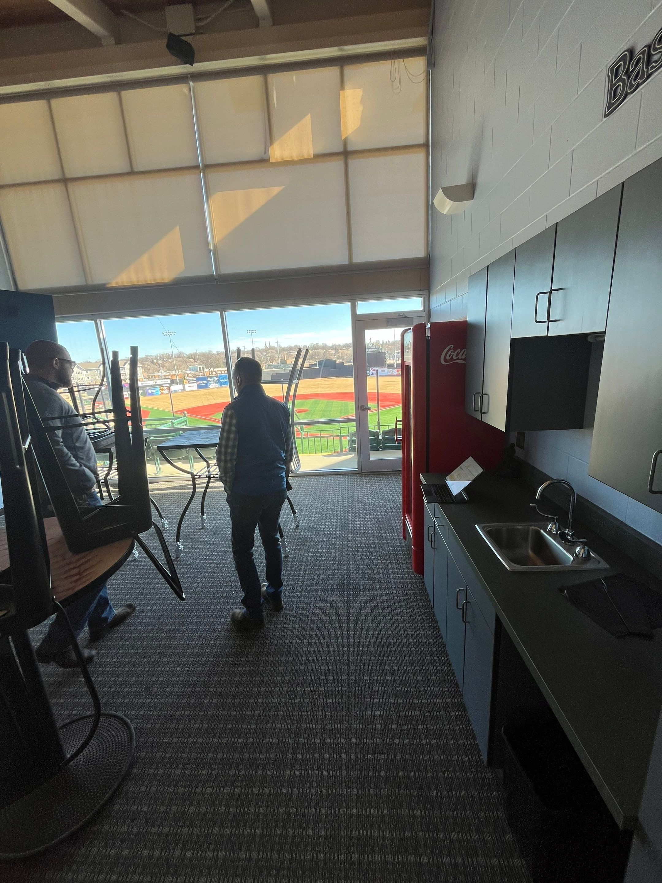 Commercial Epoxy Floor Coating for Stadium Viewing Suites in Sioux Falls by Select Painting, Coatings & Garage Cabinets
