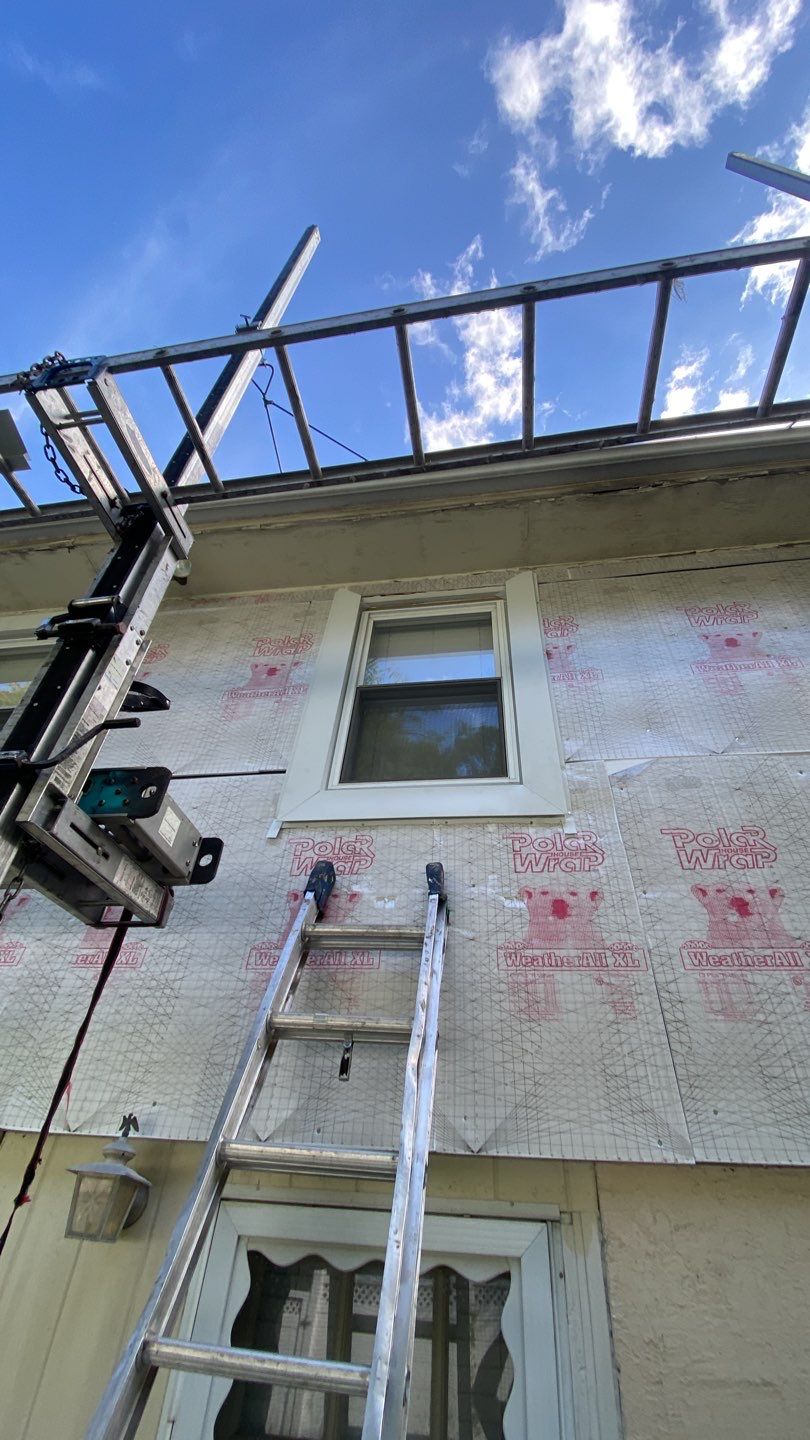 Siding Installation using CertainTeed monogram 4" double 4 Charcoal Gray by A Plus Exterior