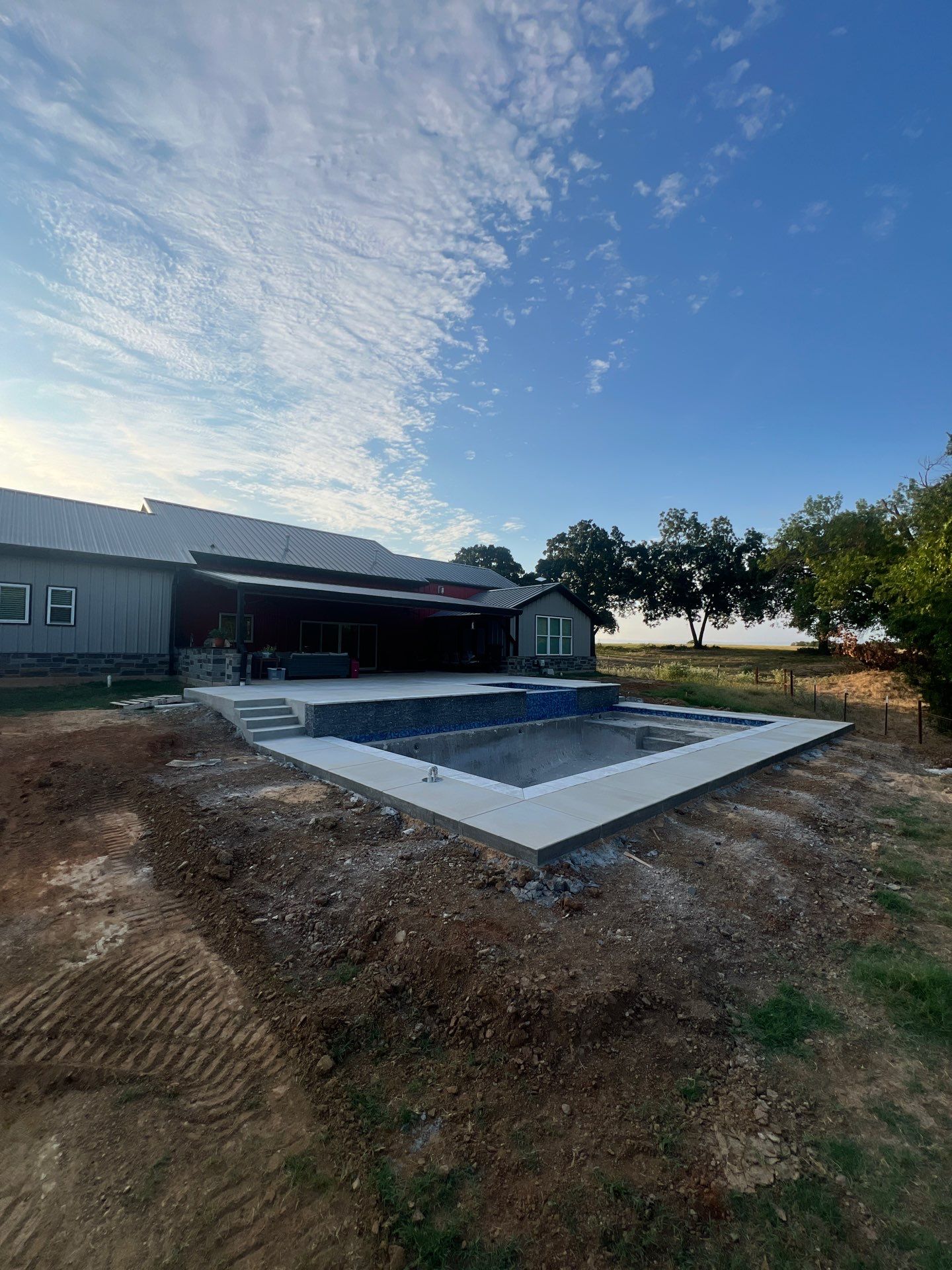 Sleek Rectangular Pool with Dark Interior Finish by Pinnacle Pools and Spas - DFW