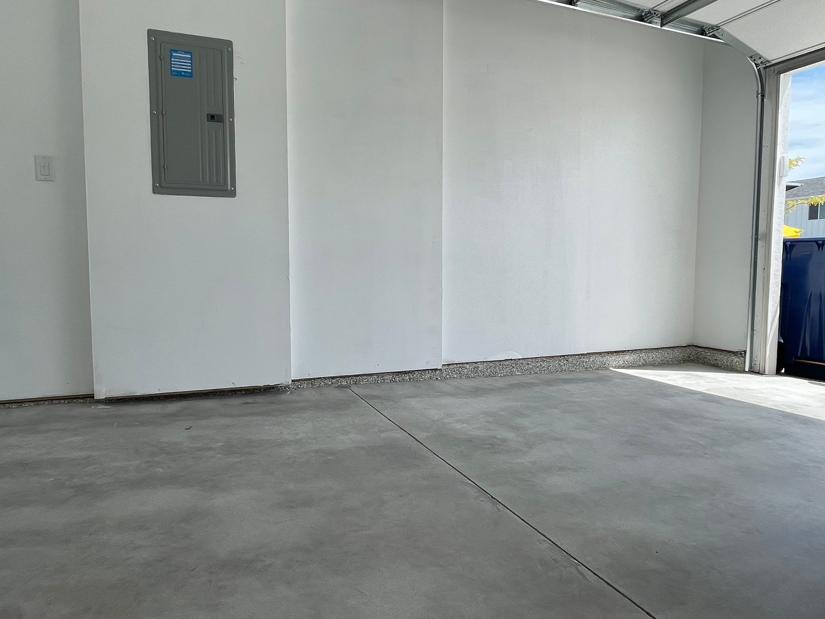 Sioux Falls Garage Floor Transformation with Cabin Fever Decorative Chips by Select Painting, Coatings & Garage Cabinets