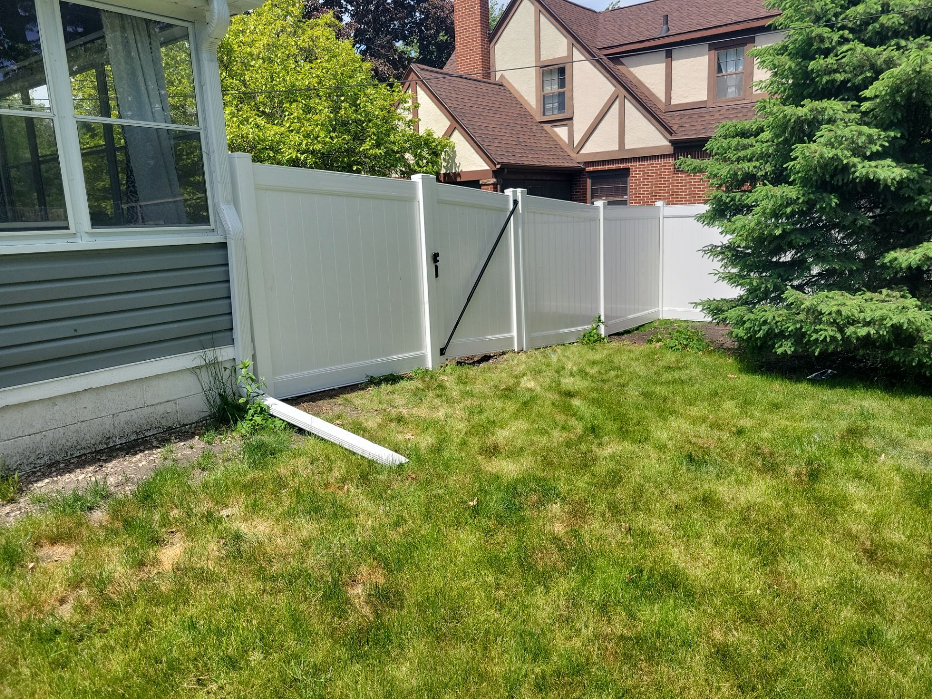 Residential White Vinyl Privacy Fence Installation in Waterloo by Perfect Picket Fence and Stain