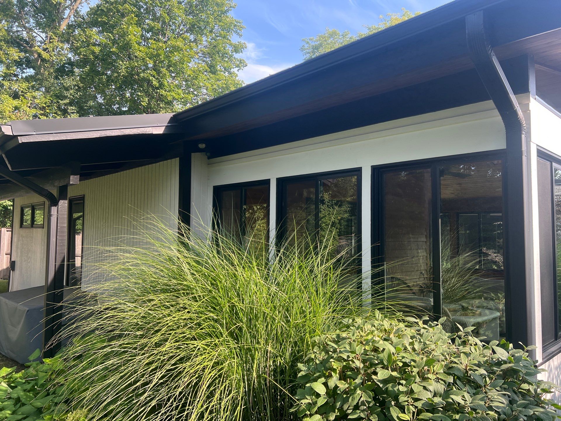 Complete Exterior House, Bluestone & Garage Floor Cleaning by Northern Power Washing LLC.