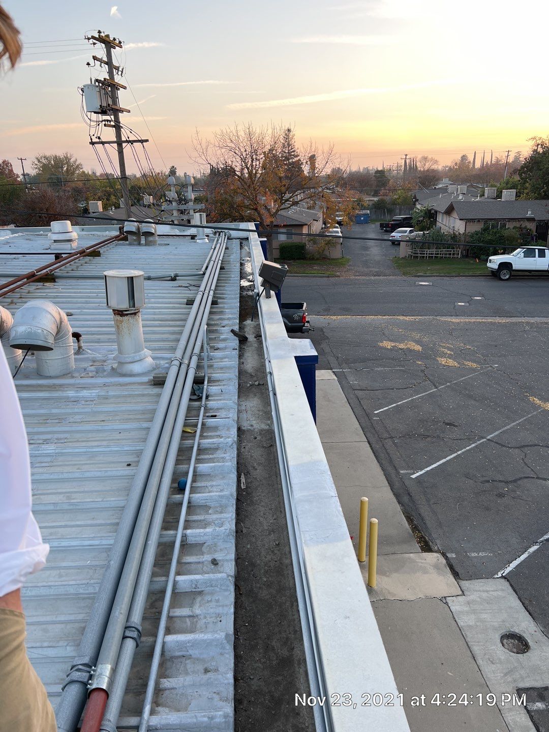 Metal roof restoration on commercial roof using Conklin Benchmark/ PUMA XL acrylic coatings over metal and foam by Straight Edge Roofing Inc