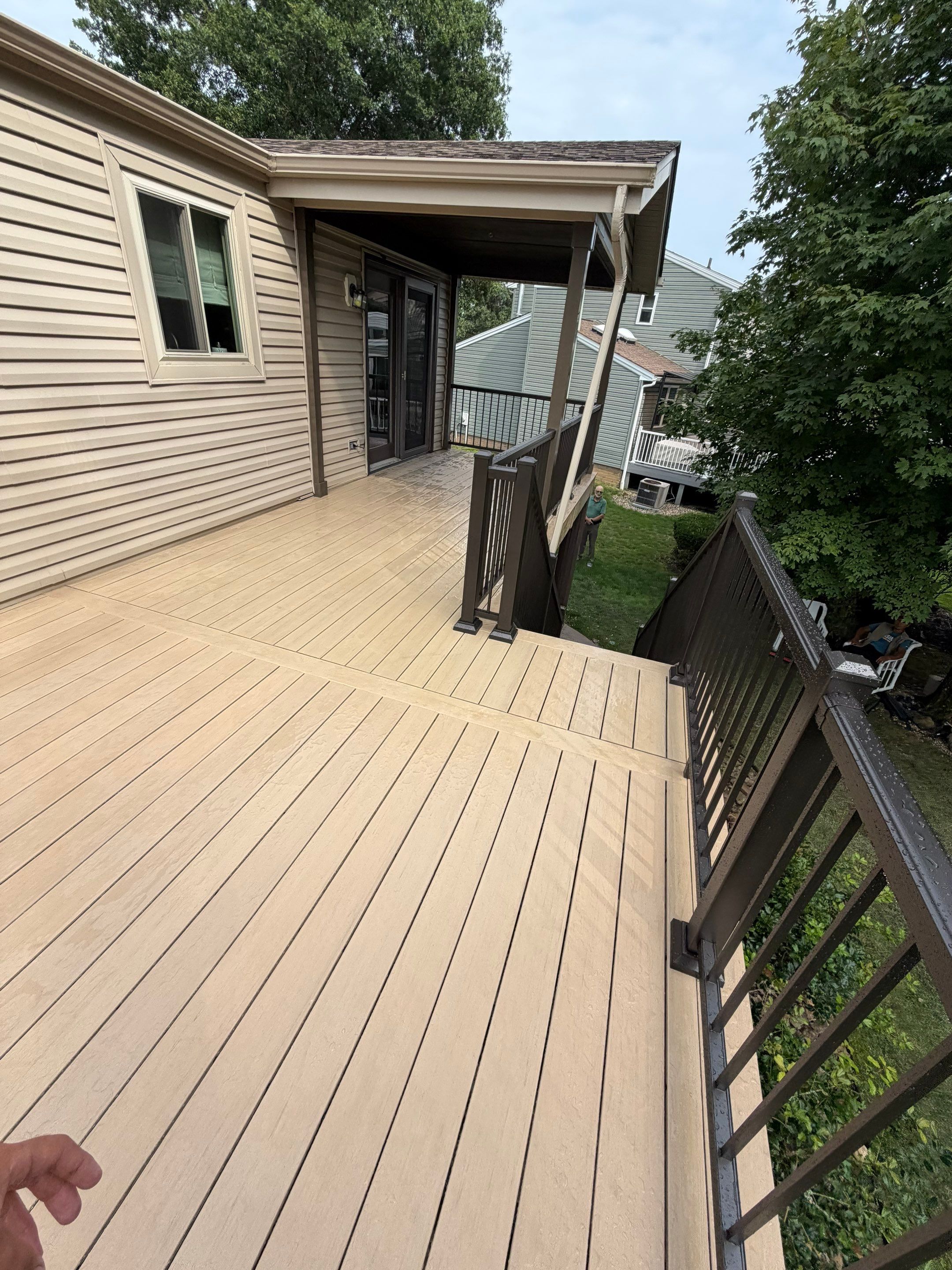 Elevated Composite Deck Installation with Covered Porch in South Park Township by Cousins Roofing Siding & Decks