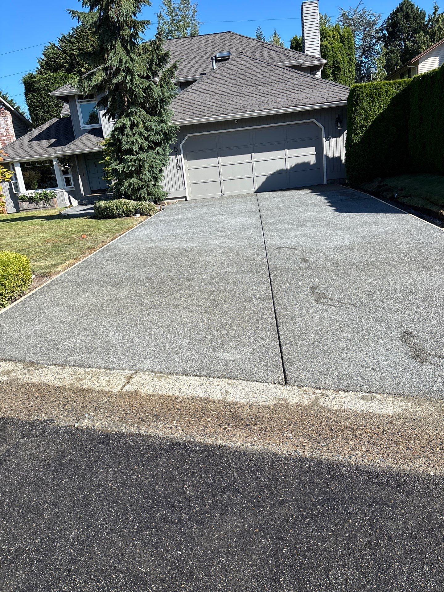 Exposed Aggregate Concrete Driveway Makeover  by Jireh Asphalt & Concrete Inc 