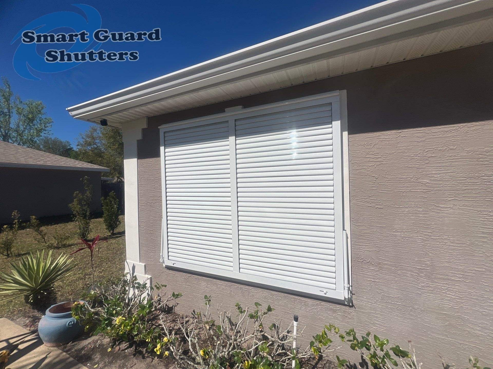 Impact Bahama in Signal White by Smart Guard Shutters