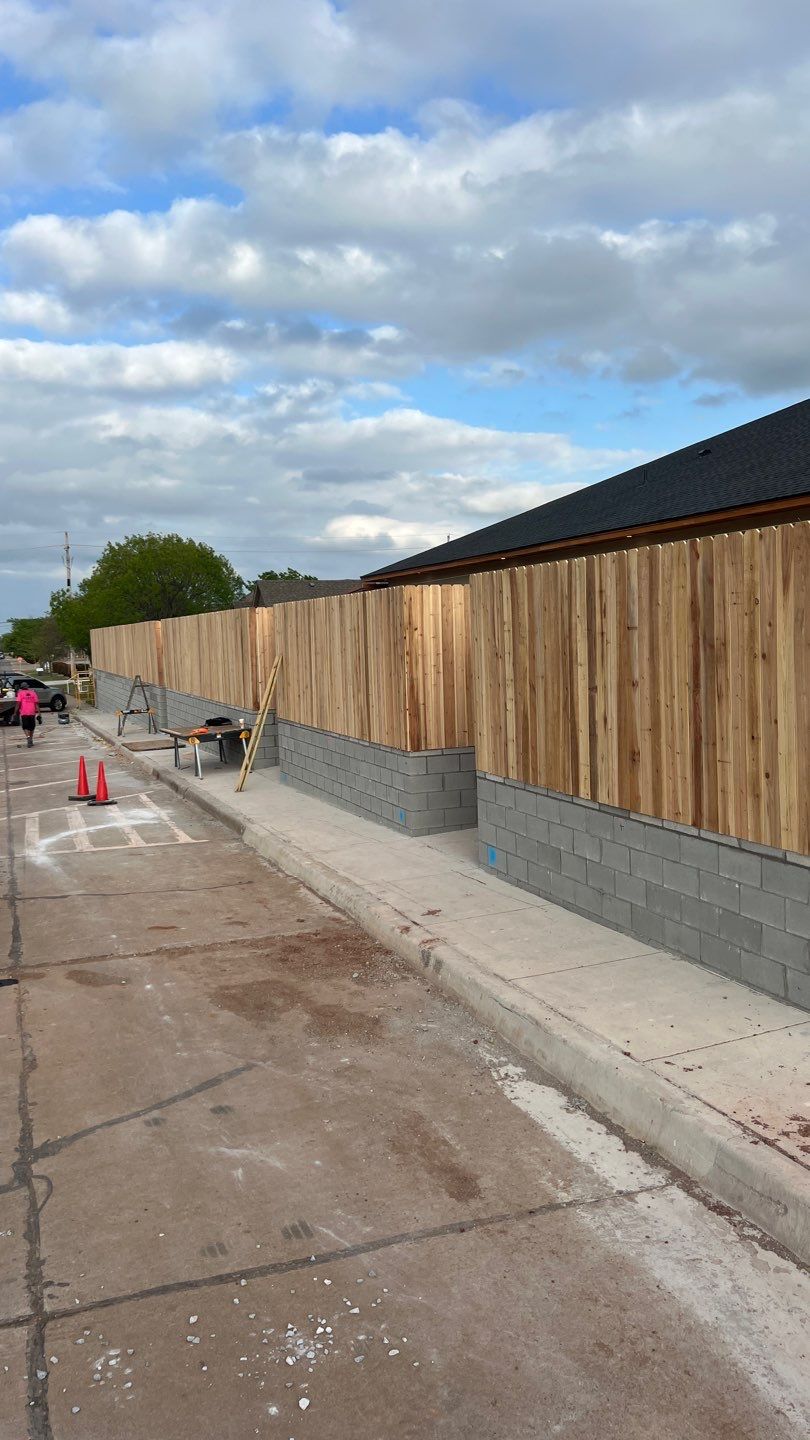Cedar Fence using Cedar Pickets and Metal Poles by Clays Services Inc