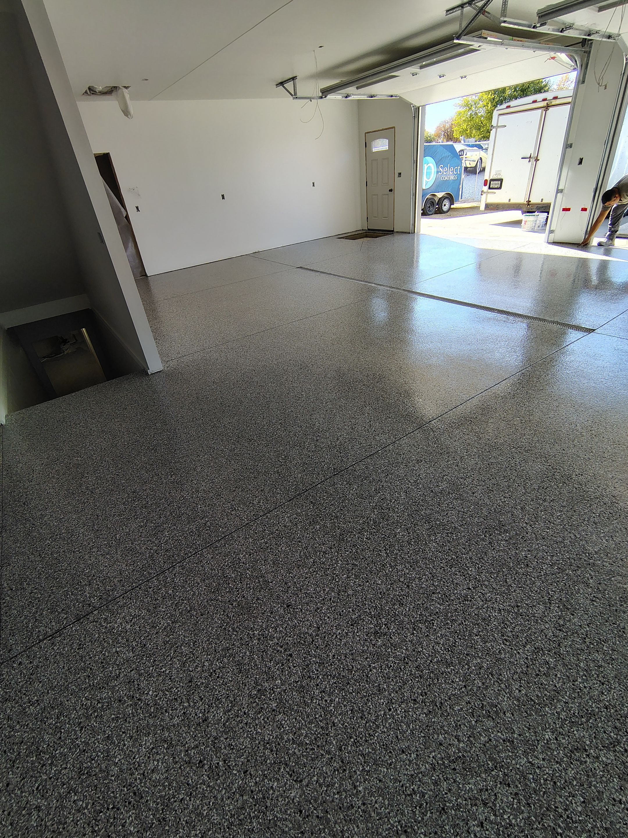 Custom Garage and Basement Epoxy Floor Coating in Menno by Select Painting, Coatings & Garage Cabinets