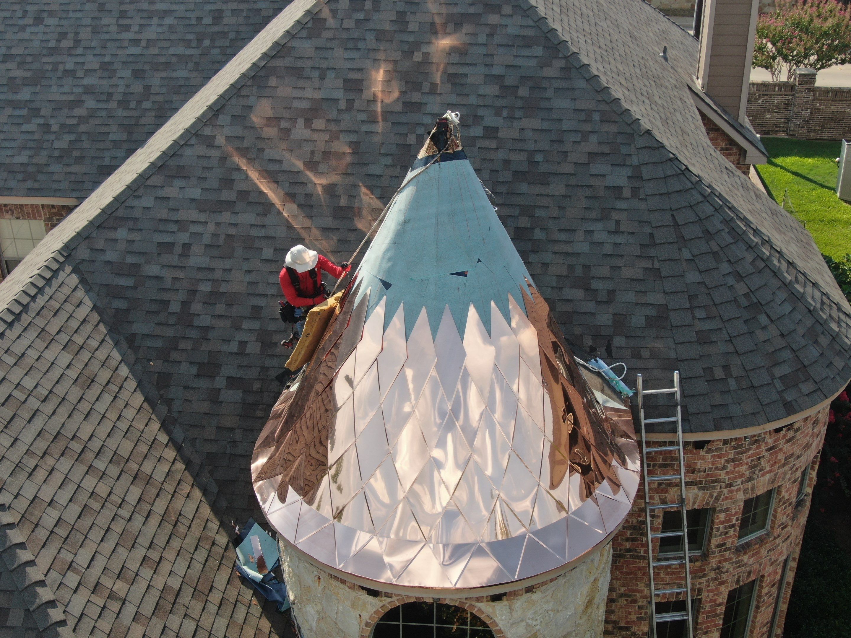 Installing Custom copper turret and Malarkey Vista Class 4 shingles Hail Damage Upgrade by Becker Roofing and Exteriors