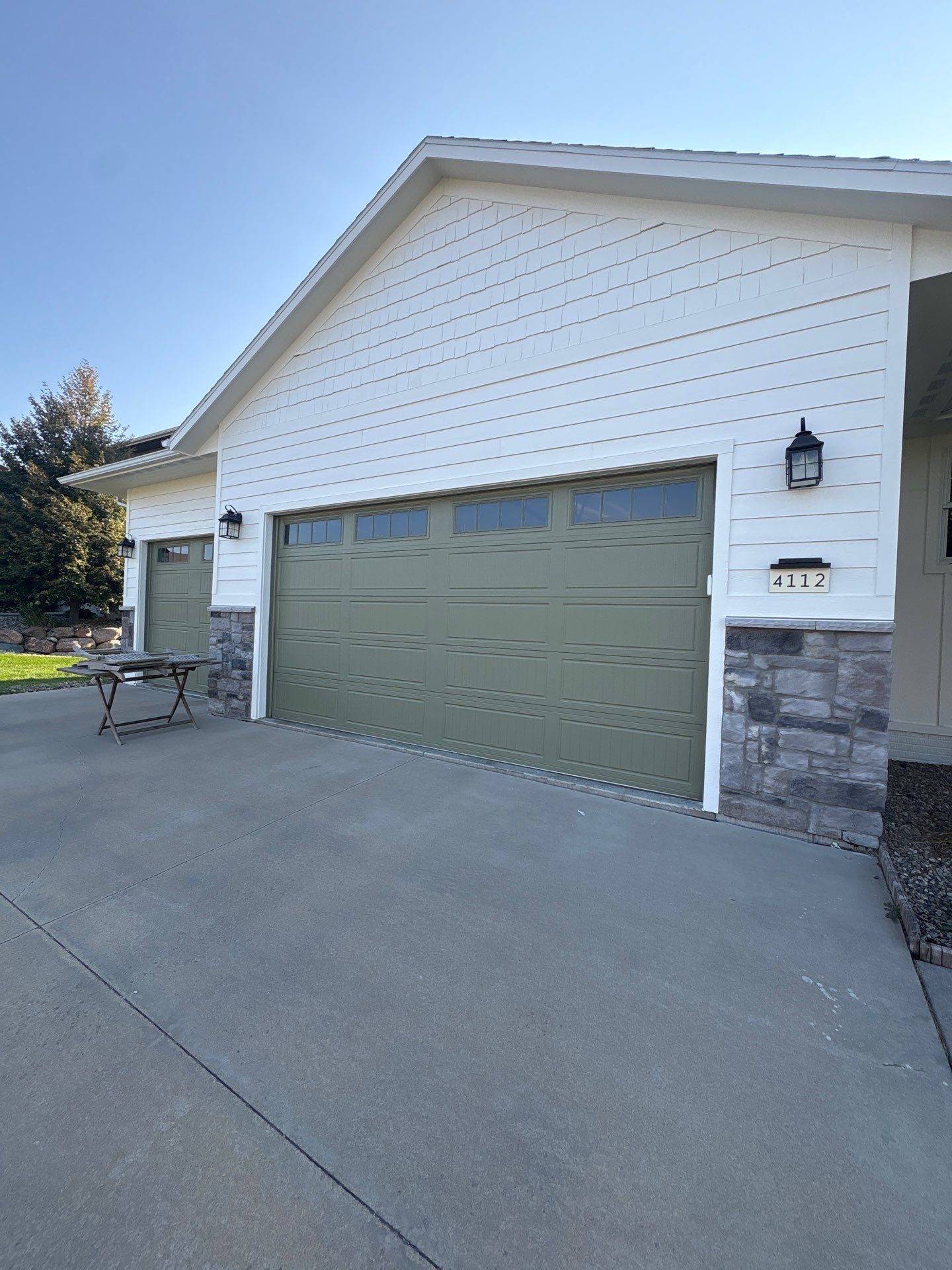 Sioux Falls Exterior Residential Siding and Deck Painting Project by Select Painting, Coatings & Garage Cabinets