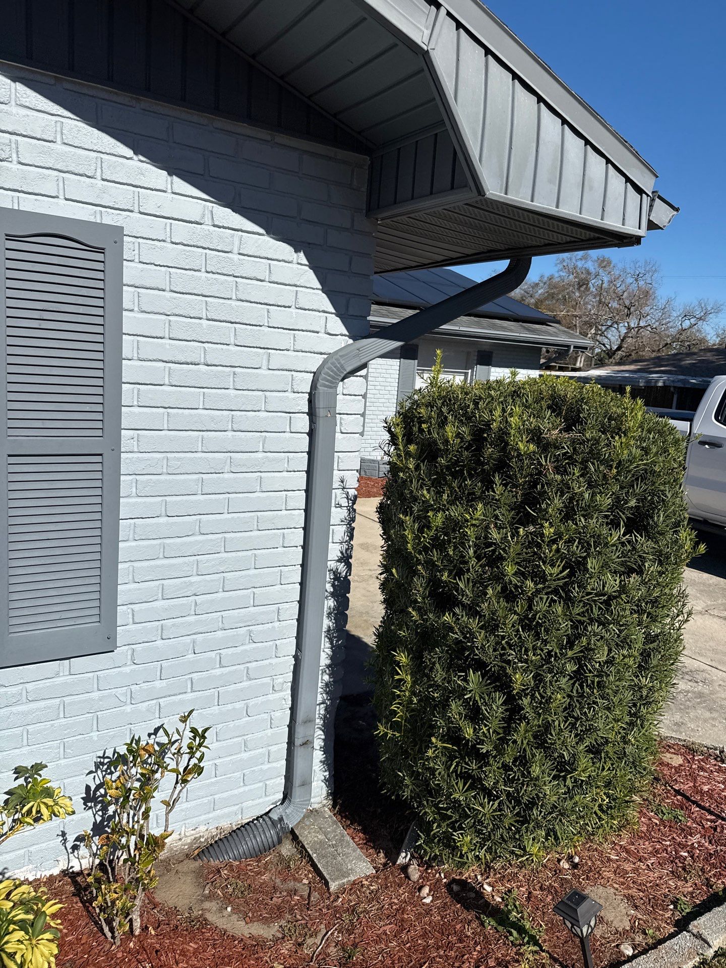 Downspout Installation using Downspout Extension and new Gutters in Winter Haven FL by Gutter Professors