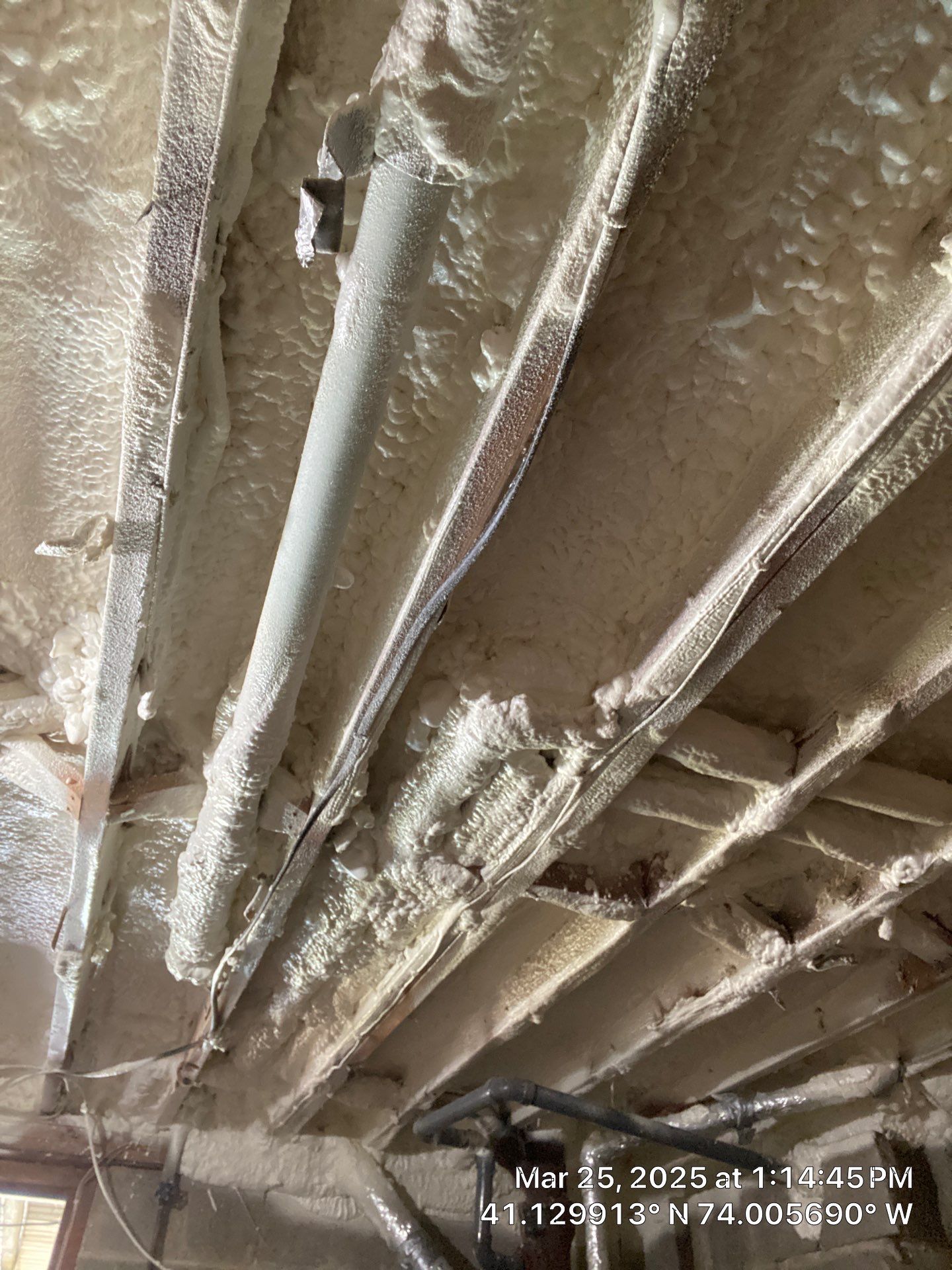 Attic Insulation using open cell spray foam and closed cell rim joist by NYS Foam & Energy