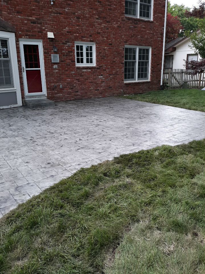 Back Yard Stamped Patio by LAND ESCAPES LLC