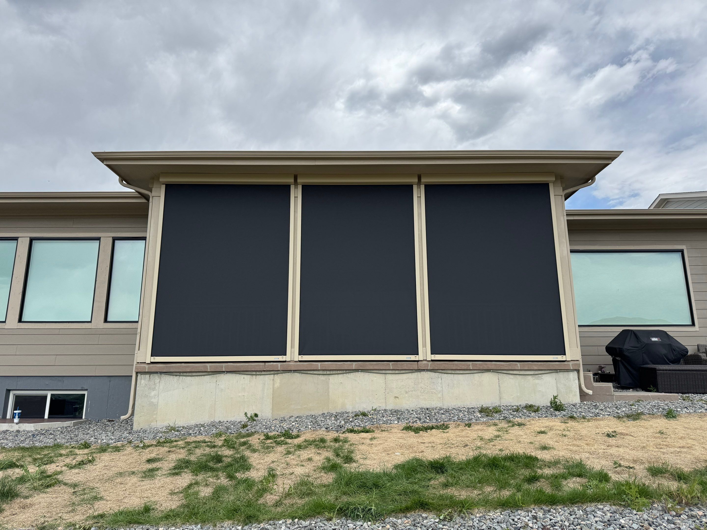 Exterior MagnaTrack Solar Screen Installation on Castle Rock Covered Patio by Outdoor Solutions Colorado