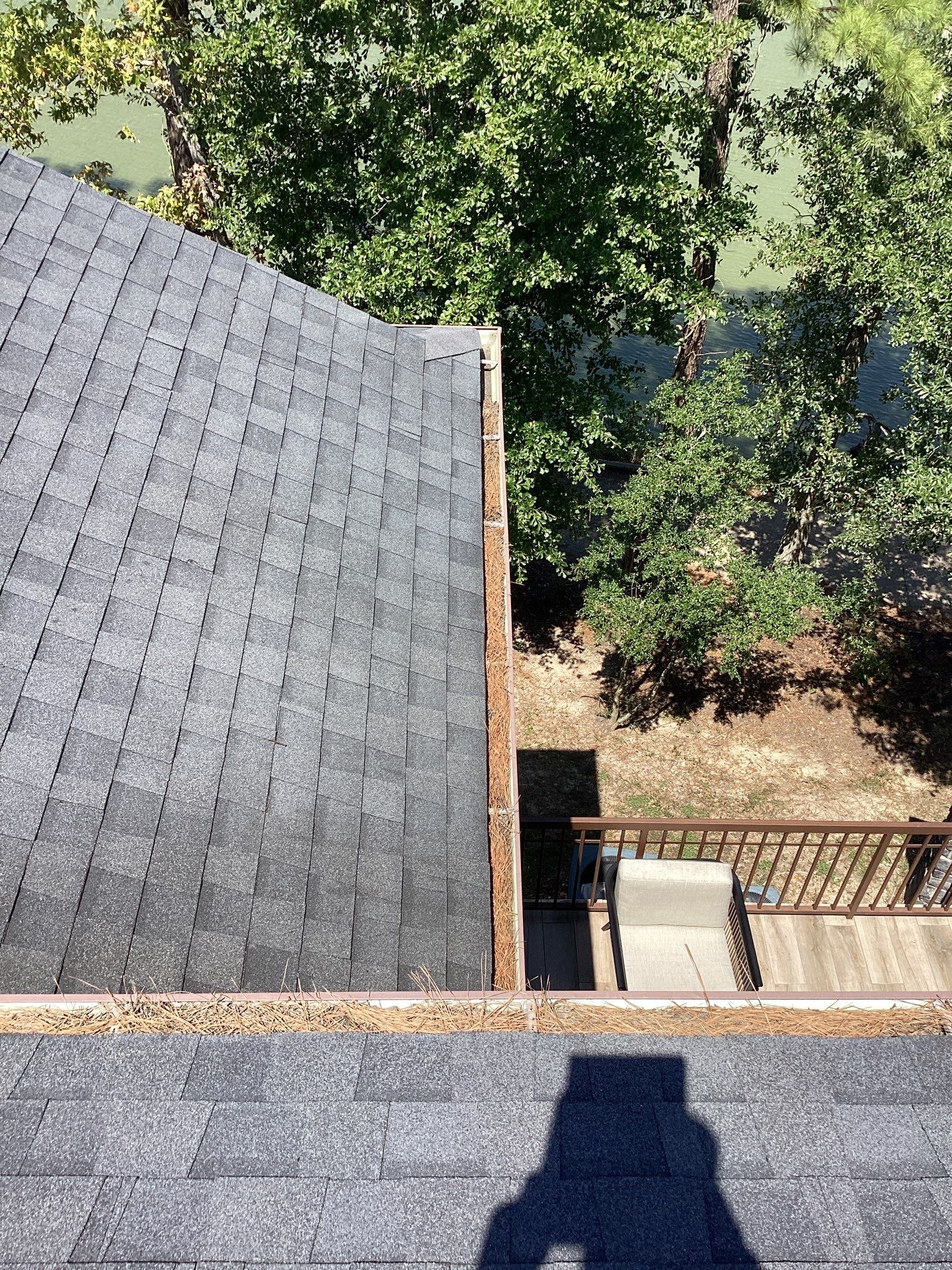 Commercial gutter cleaning Houston before photo with filled gutters