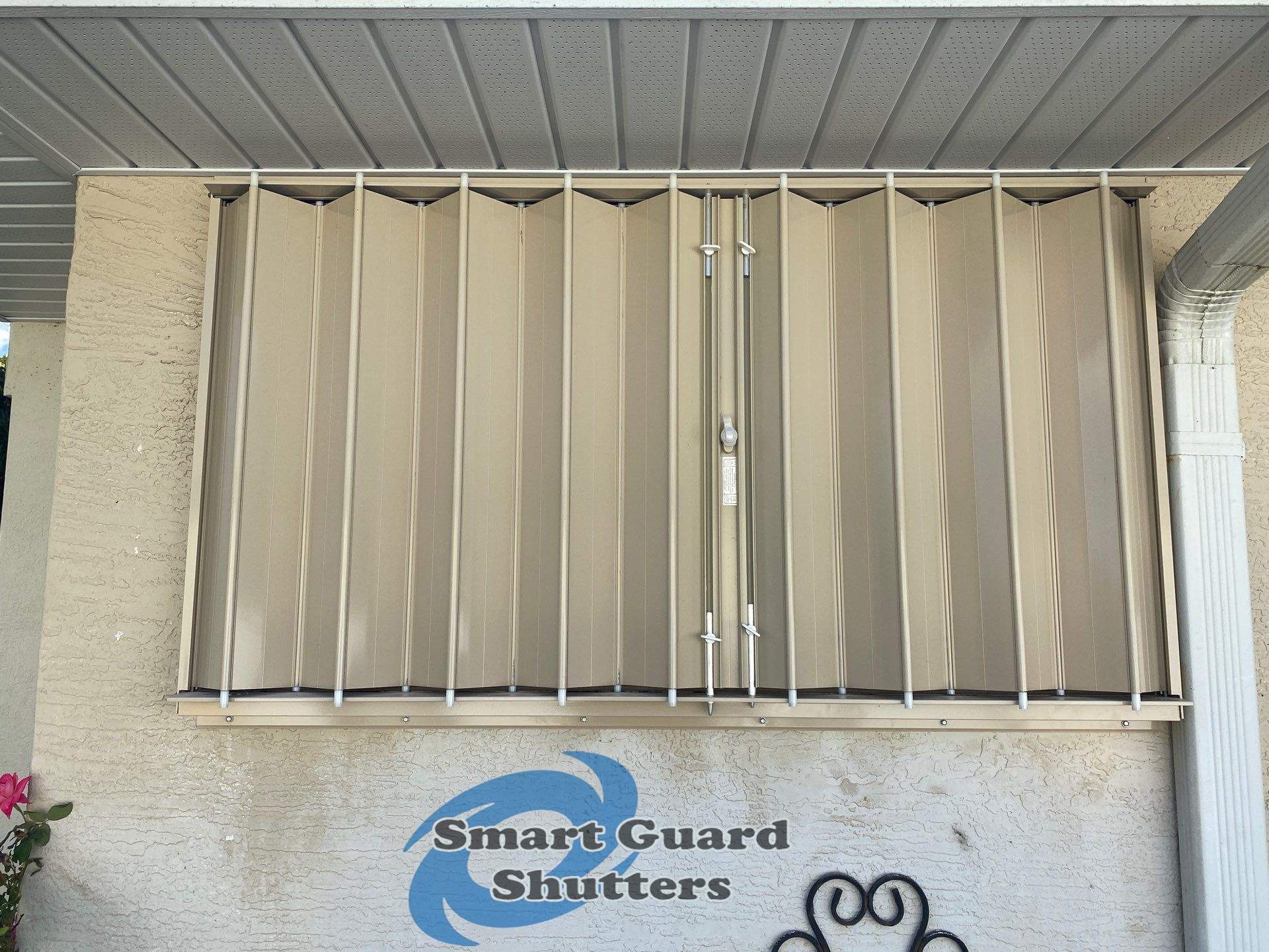Accordion Shutters in Beige by Smart Guard Shutters