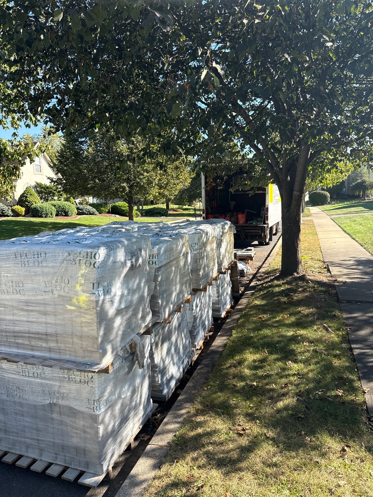 Backyard Retreat: Techo-Bloc Patio + Firepit Lounge by Saylor’s Lawn & Landscape