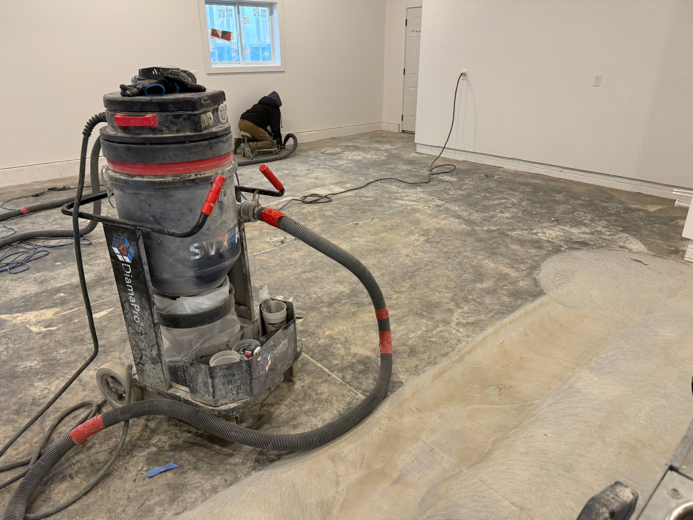 Multi-Car Garage Epoxy Floor Coating and Concrete Finishing in Sioux Falls by Select Painting, Coatings & Garage Cabinets