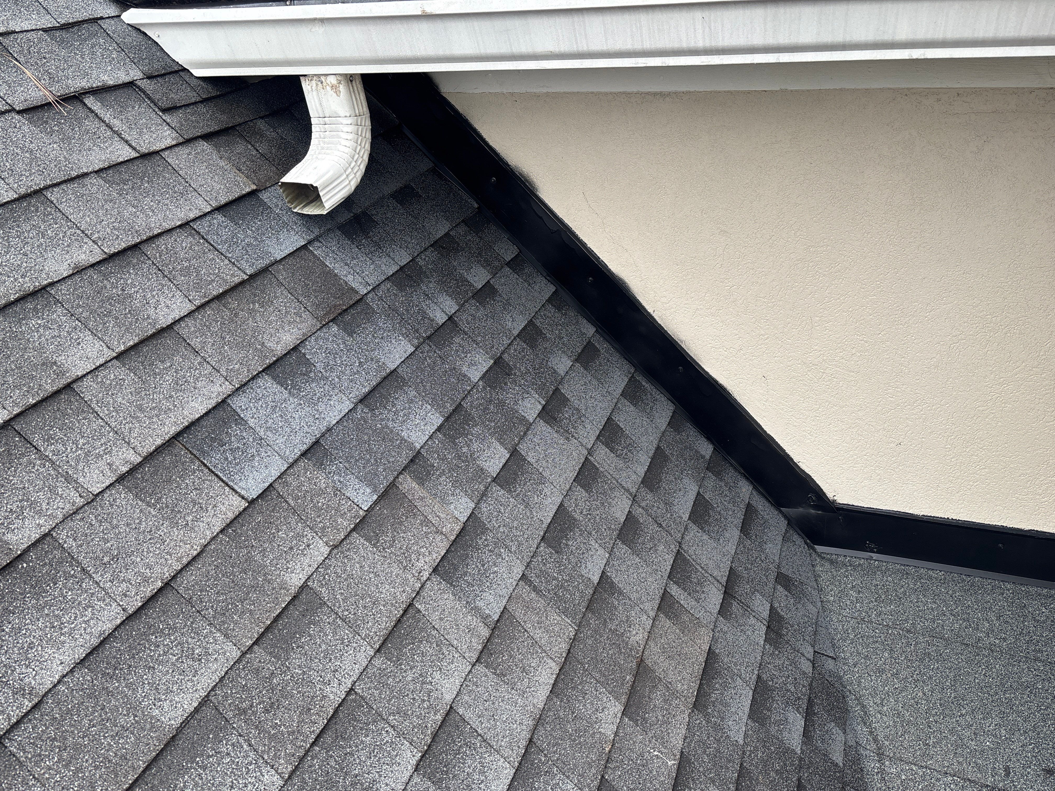 Wrong V valley section installed  by Deerfield Roofing LLC