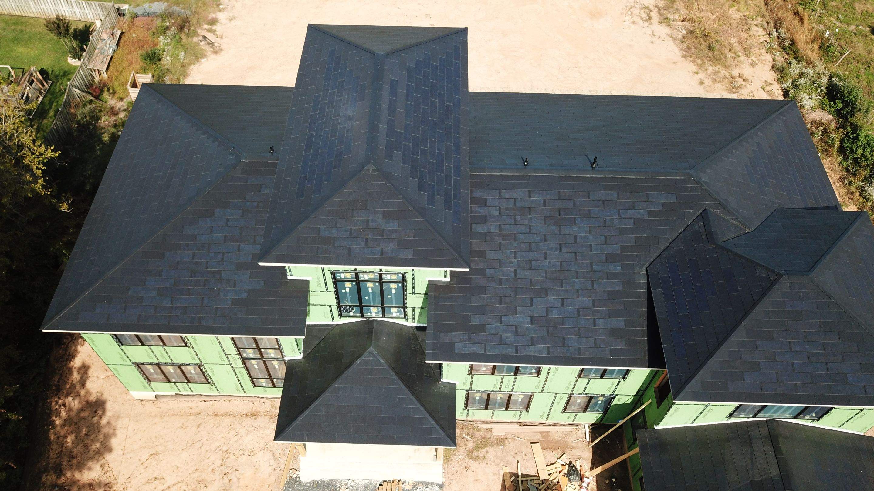 Tesla Solar Roof  using Tesla Solar Roof V3 tiles by American Home Contractors