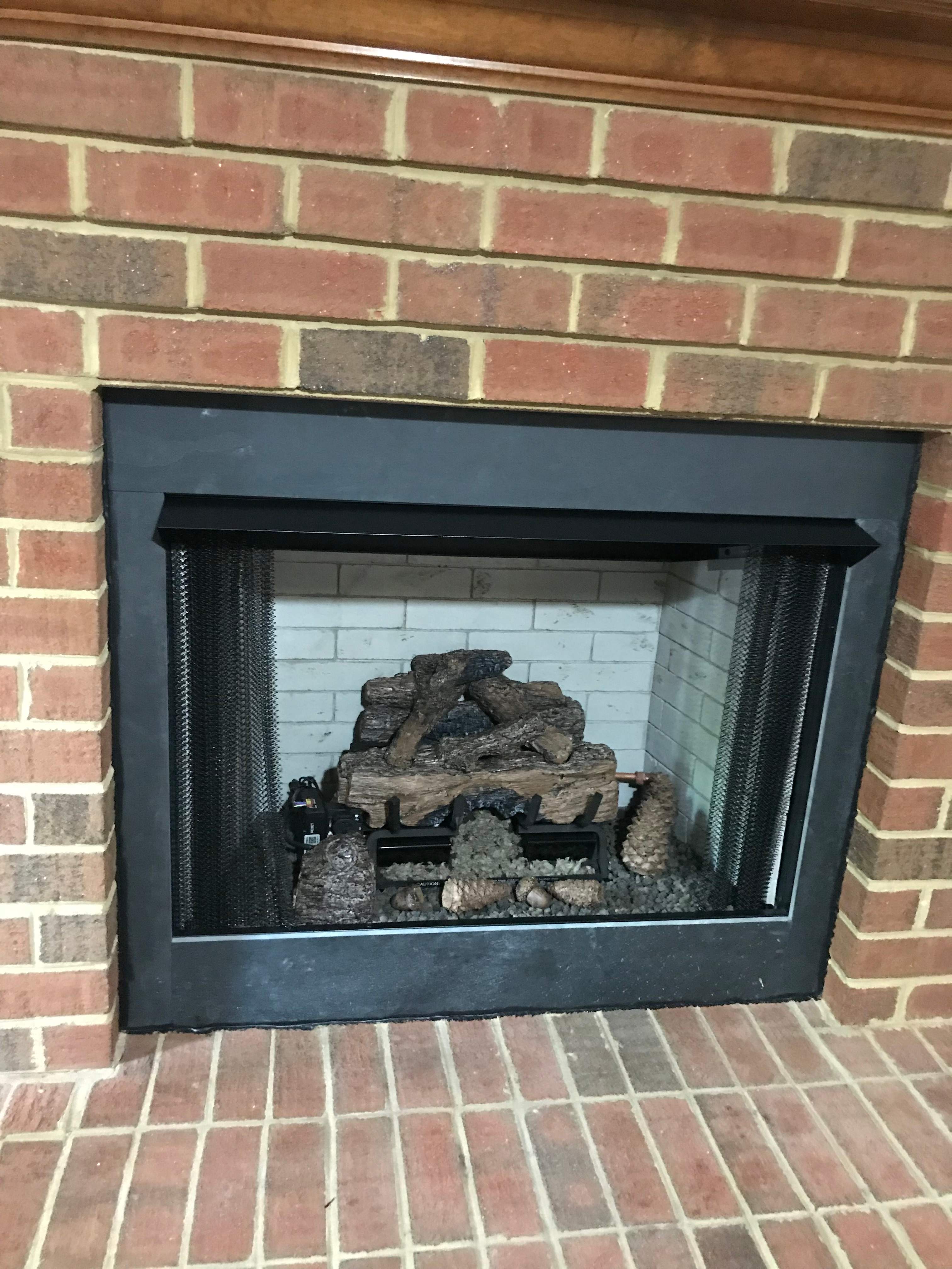 Gas Fireplace + Stone by Premier Chimney and Roofing