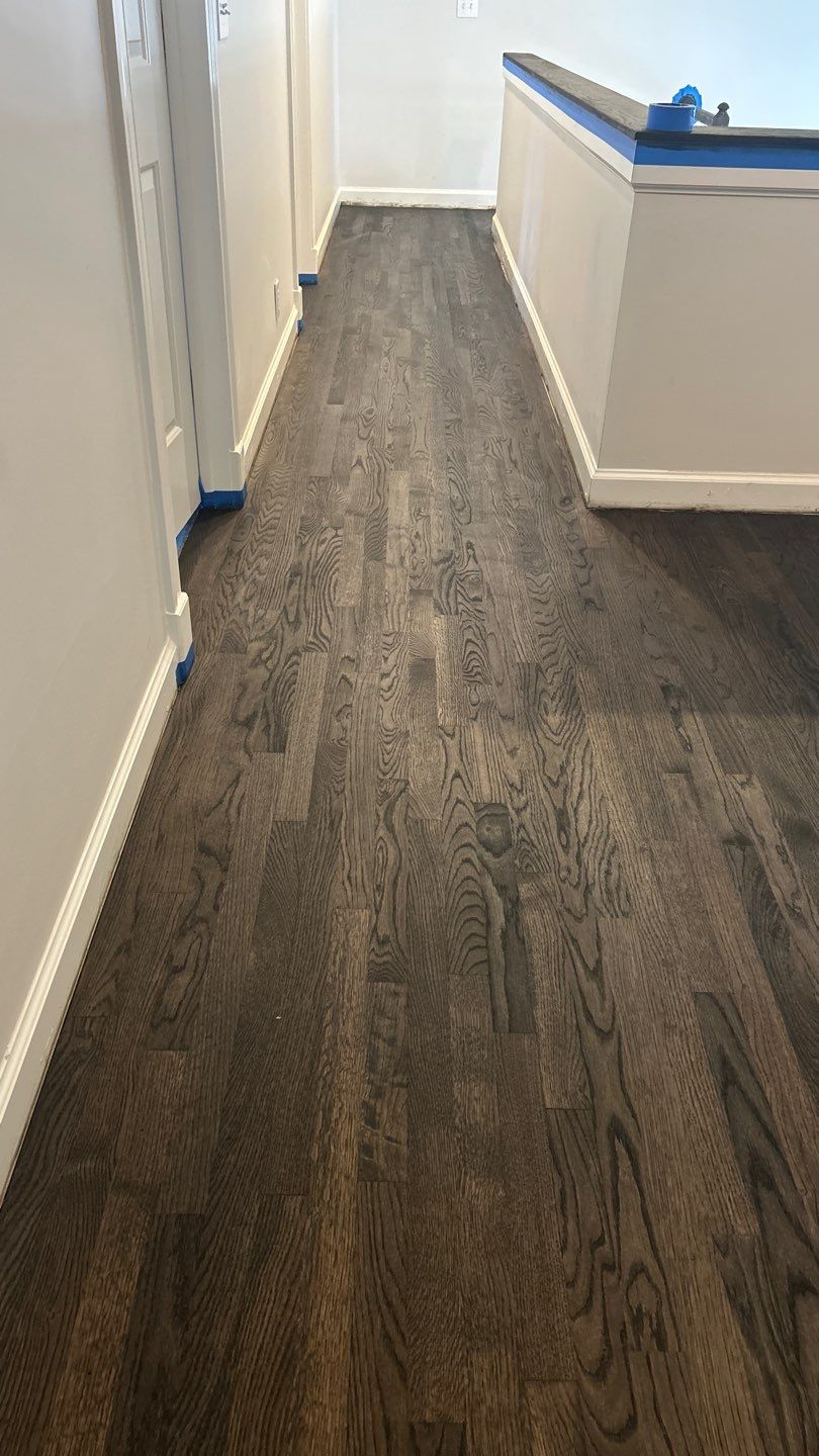 Updated staircase and hallway by Footprints Floors of Nashville