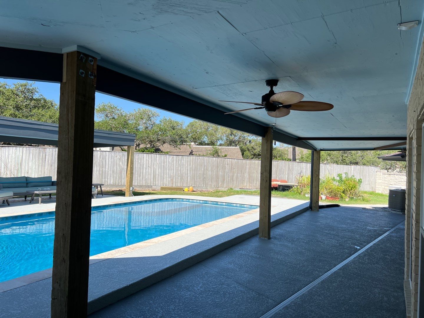 Beautiful pool side build by Bayfront Roofing and Construction