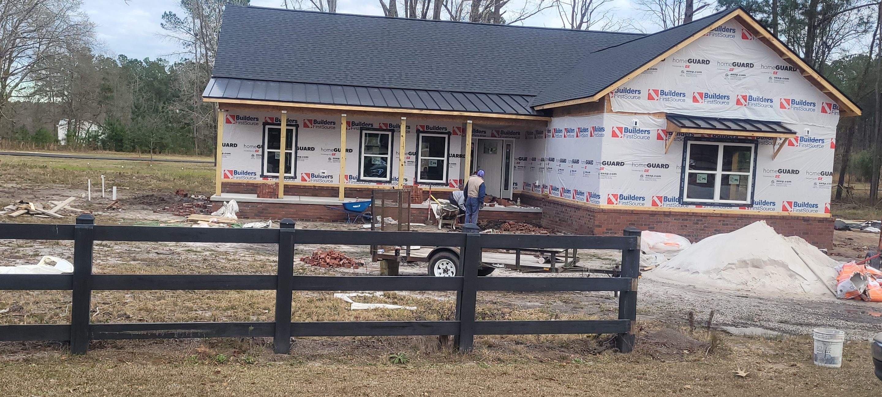 New Home Construction using brick and vertical vinyl by Cornerstone Home Builders, LLC