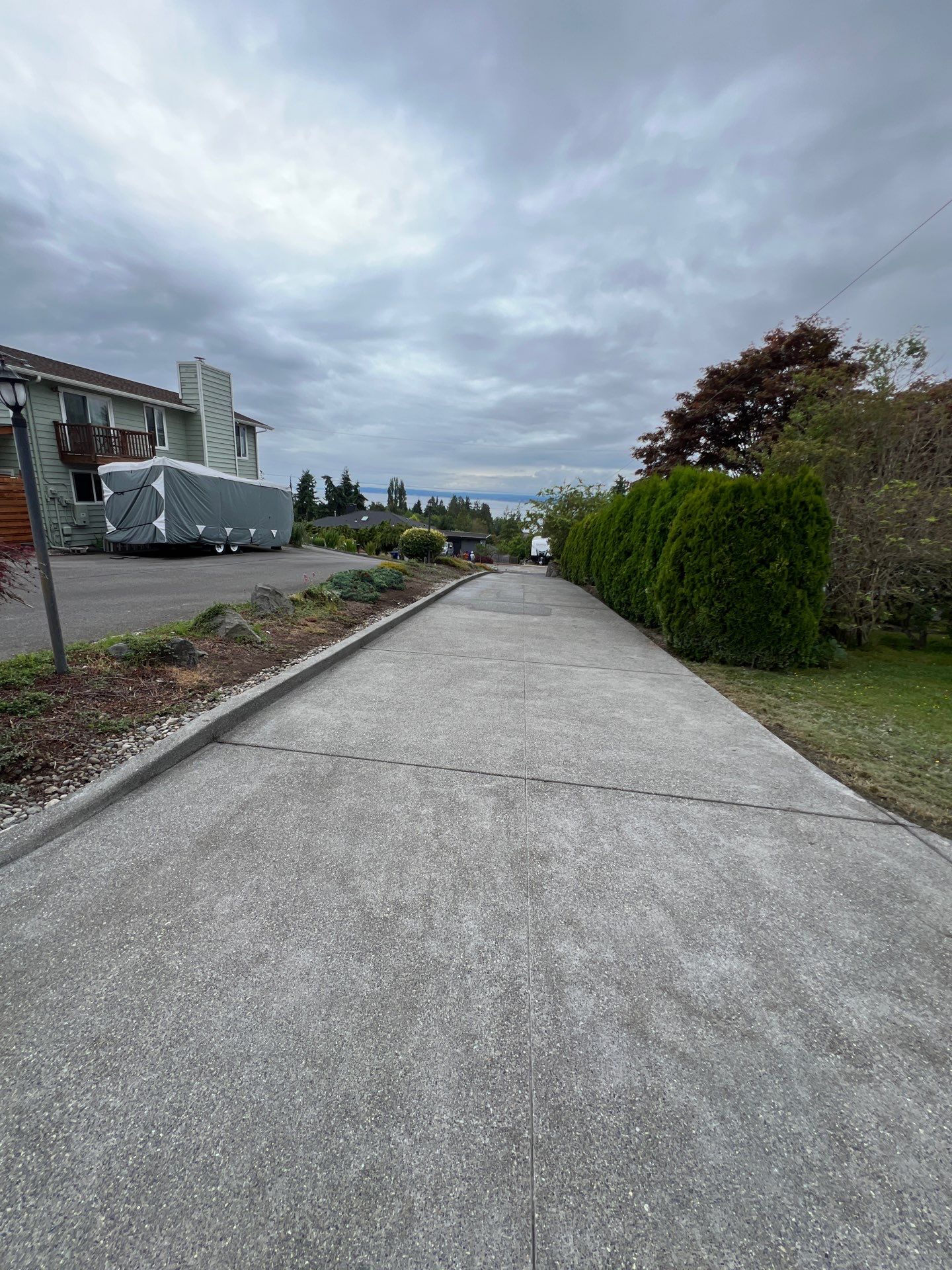 Concrete Driveway Makeover w/ Asphalt Patch | Everett  by Jireh Asphalt & Concrete Inc 