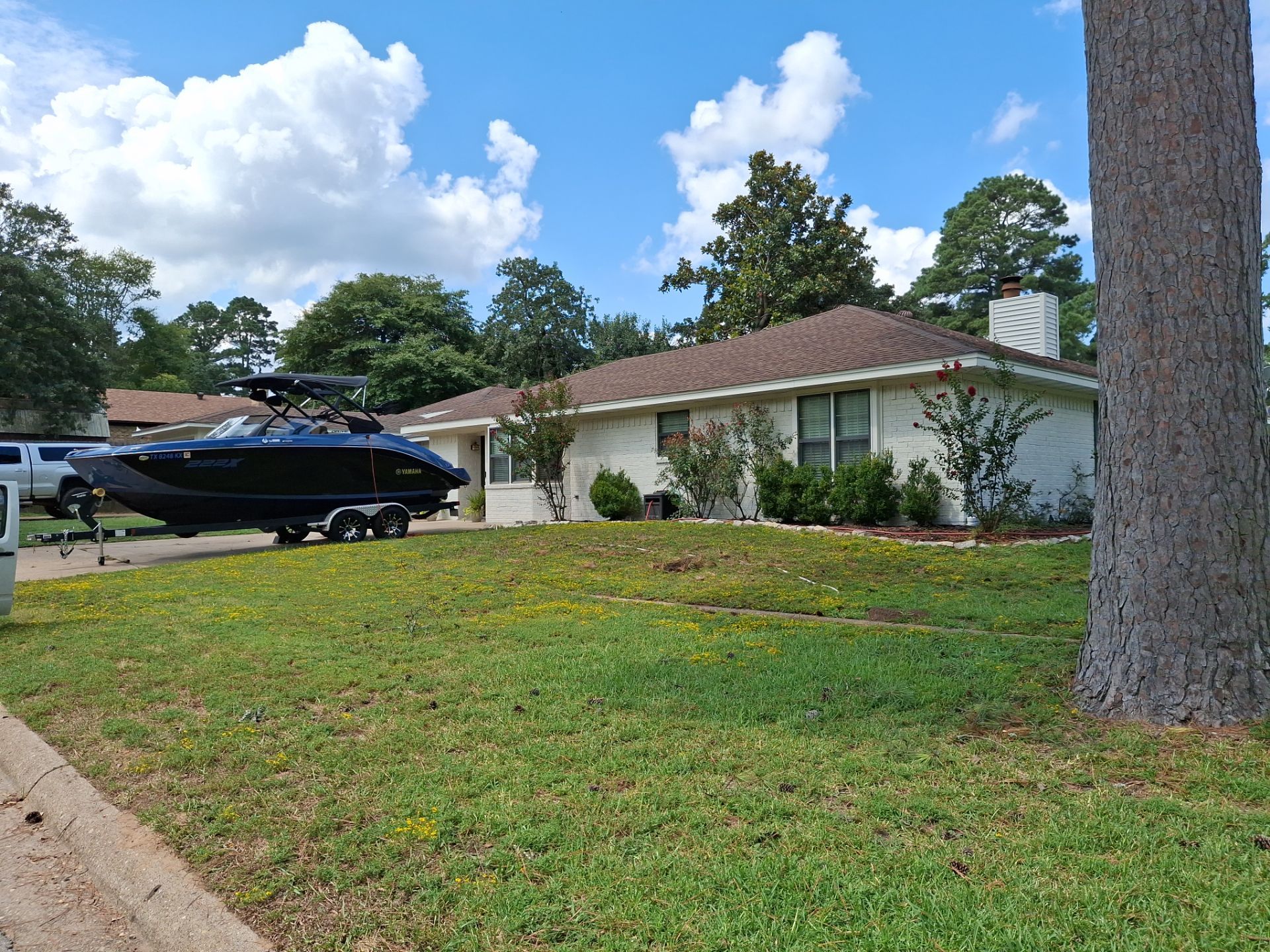 Exterior Painting in Flint, TX | White Brick Home & Metal Building with Sherwin-Williams Duration by Quality Coats Painting