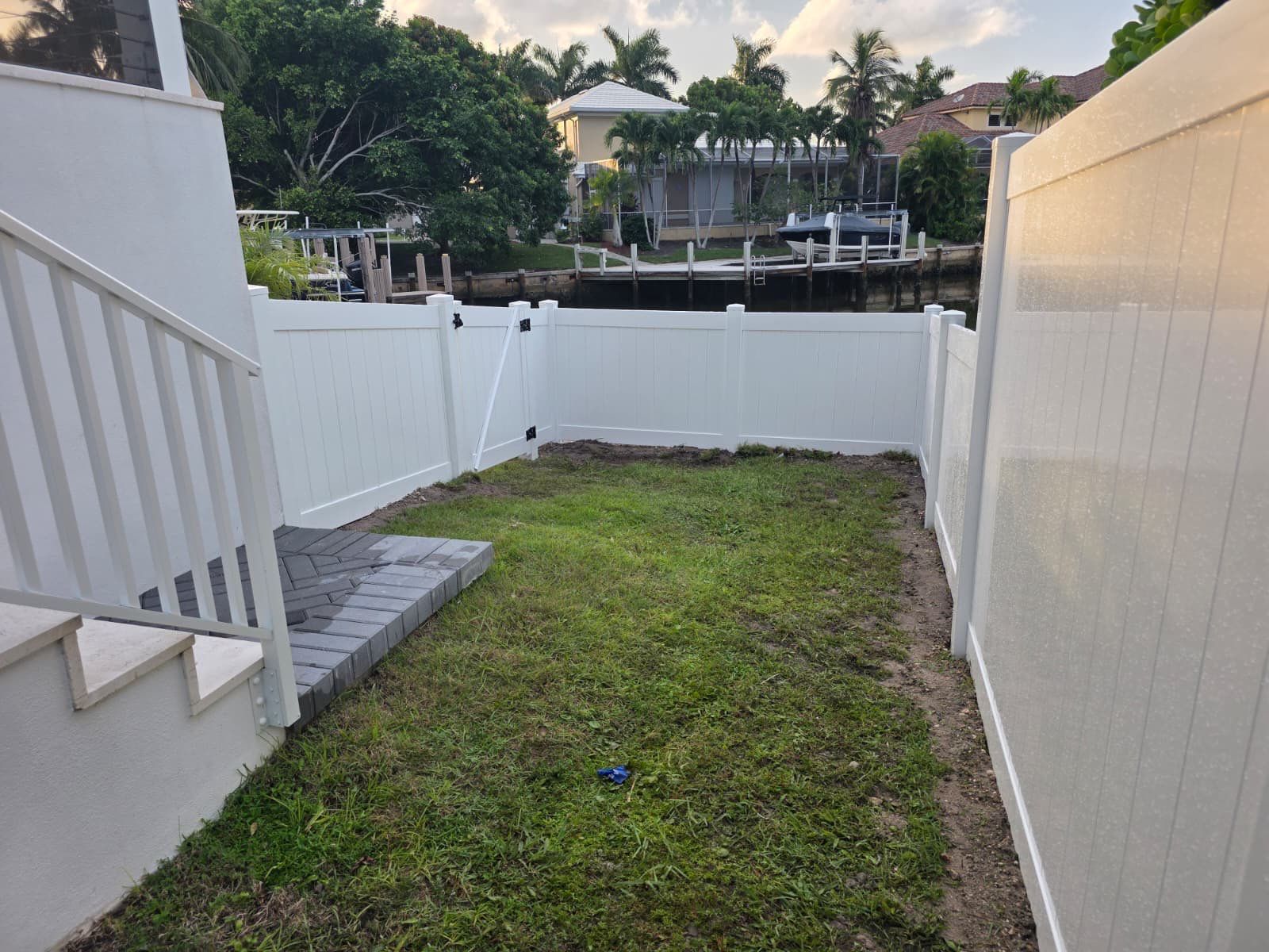 Marco Island Waterfront Vinyl Privacy Fence and Aluminum Railing by True Fence LLC