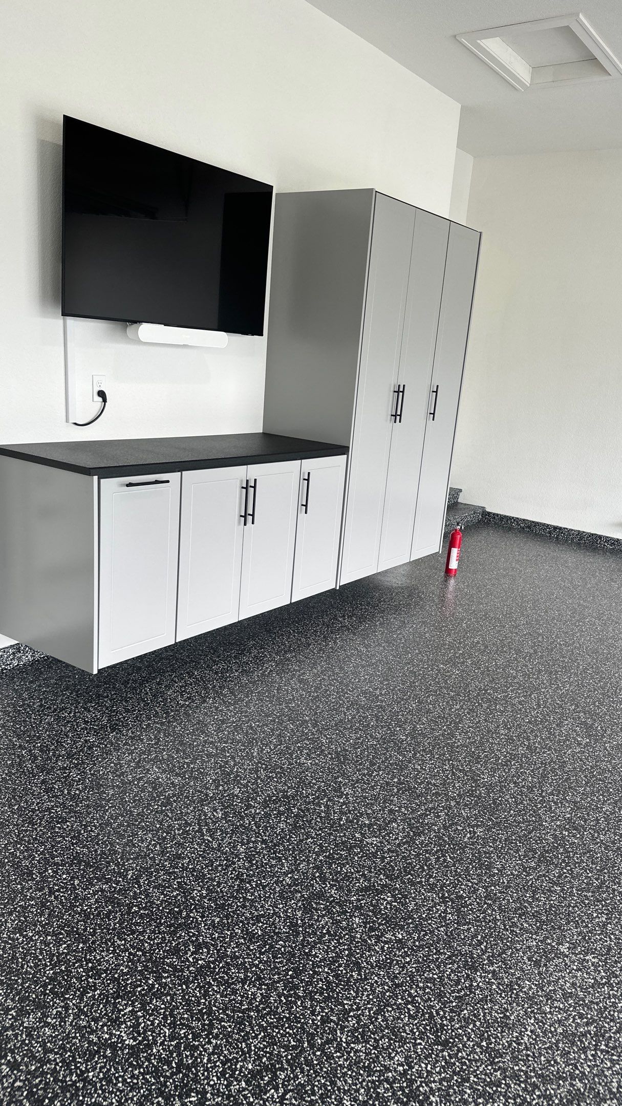 John H. received his dream garage with cabinets and a Banner Garage Floor by Banner Garage