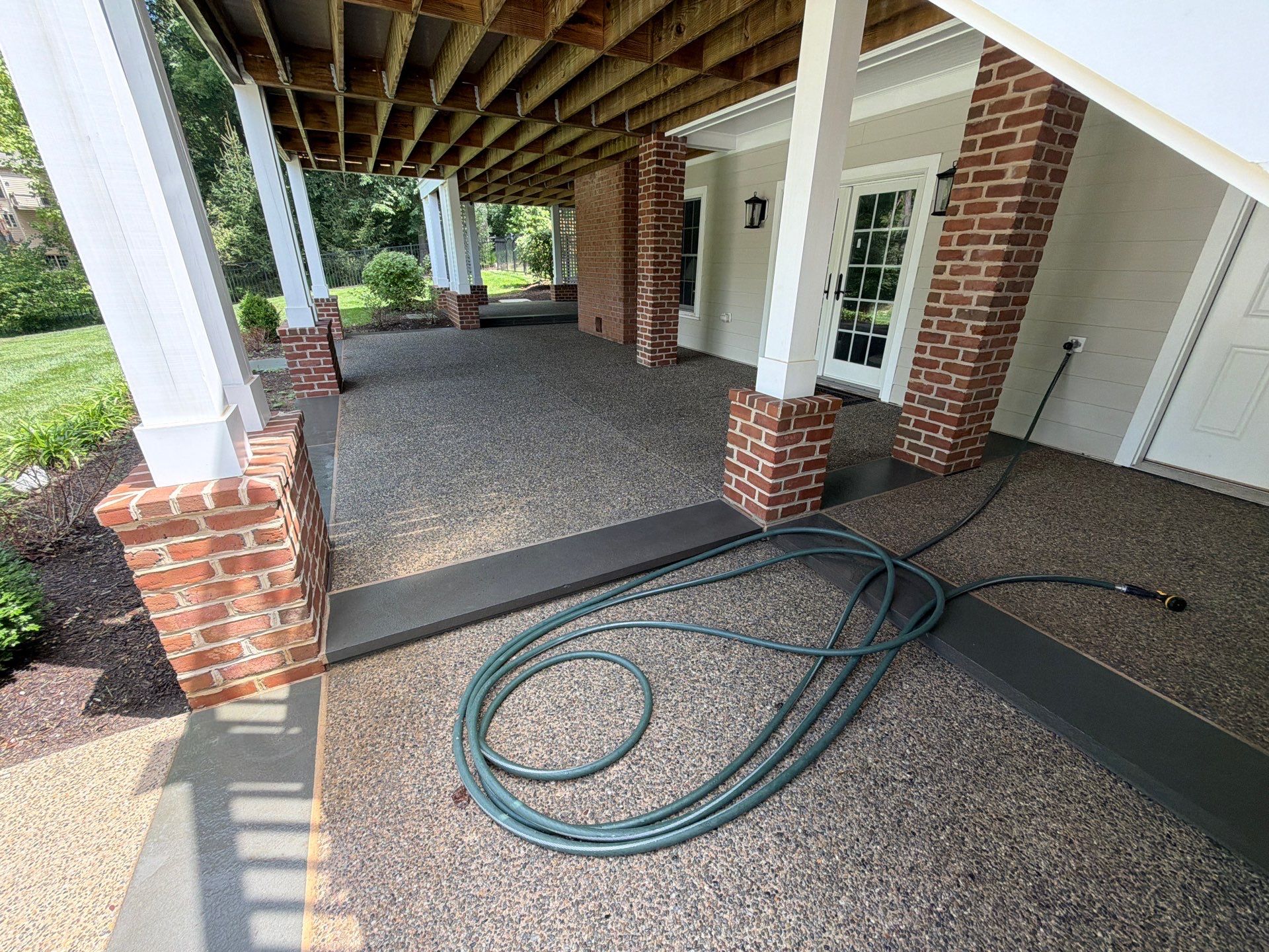 Composite Deck and Stone Paver Walkway power washing. by Baltimore Pressure Washers Inc.