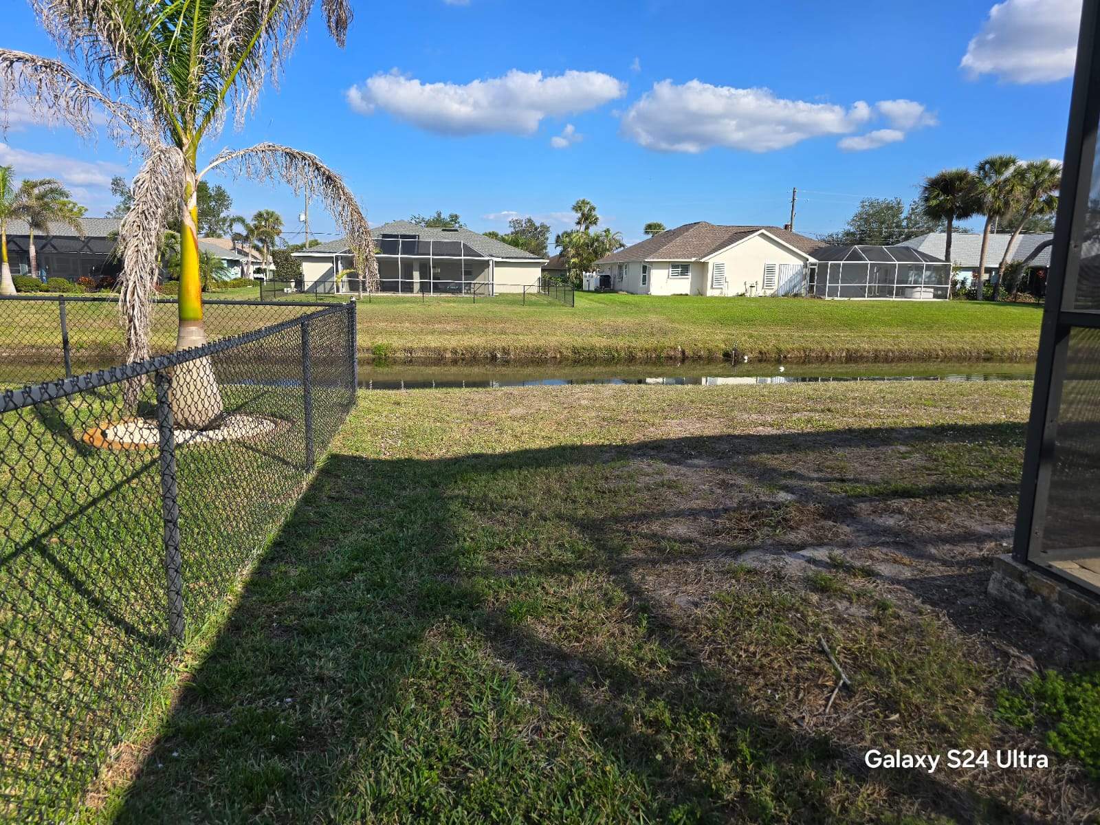 Waterfront Black Chain Link Fence Installation in Rotonda West by True Fence LLC