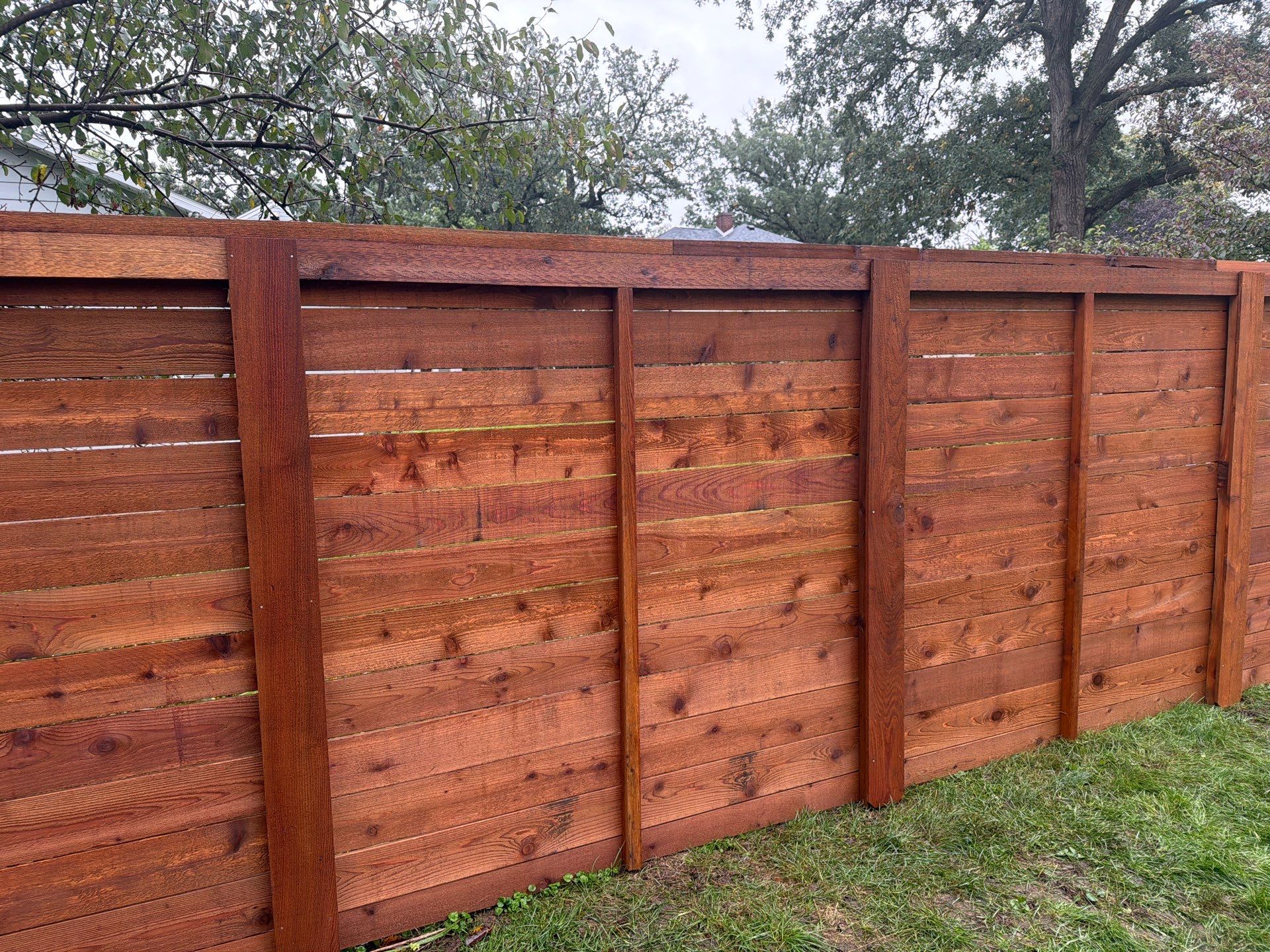 Stained Horizontal Cedar Wood Privacy Fence in Cedar Falls by Perfect Picket Fence and Stain