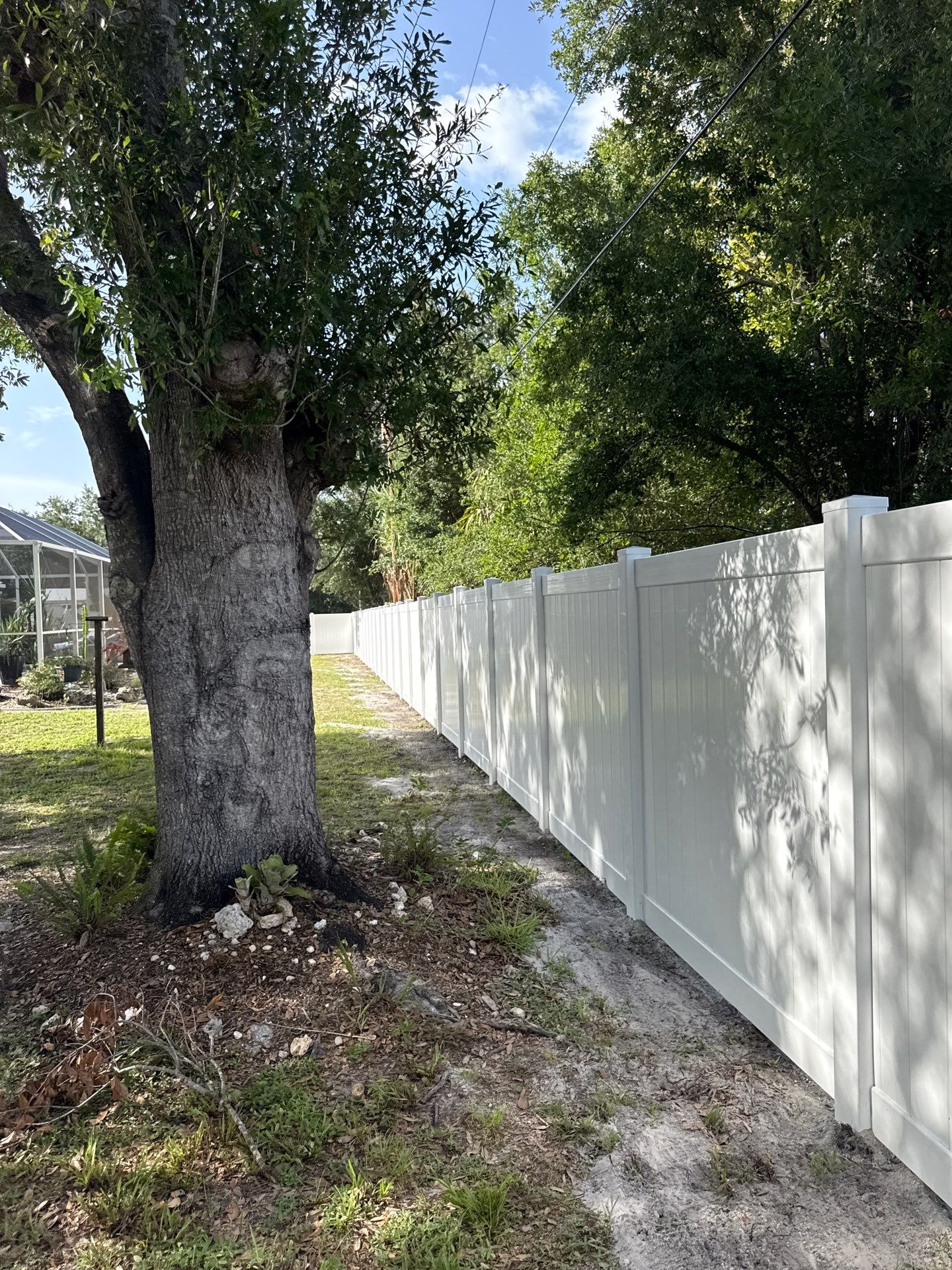 White Vinyl Privacy Fence Installation and Gate Assembly in Punta Gorda by True Fence LLC