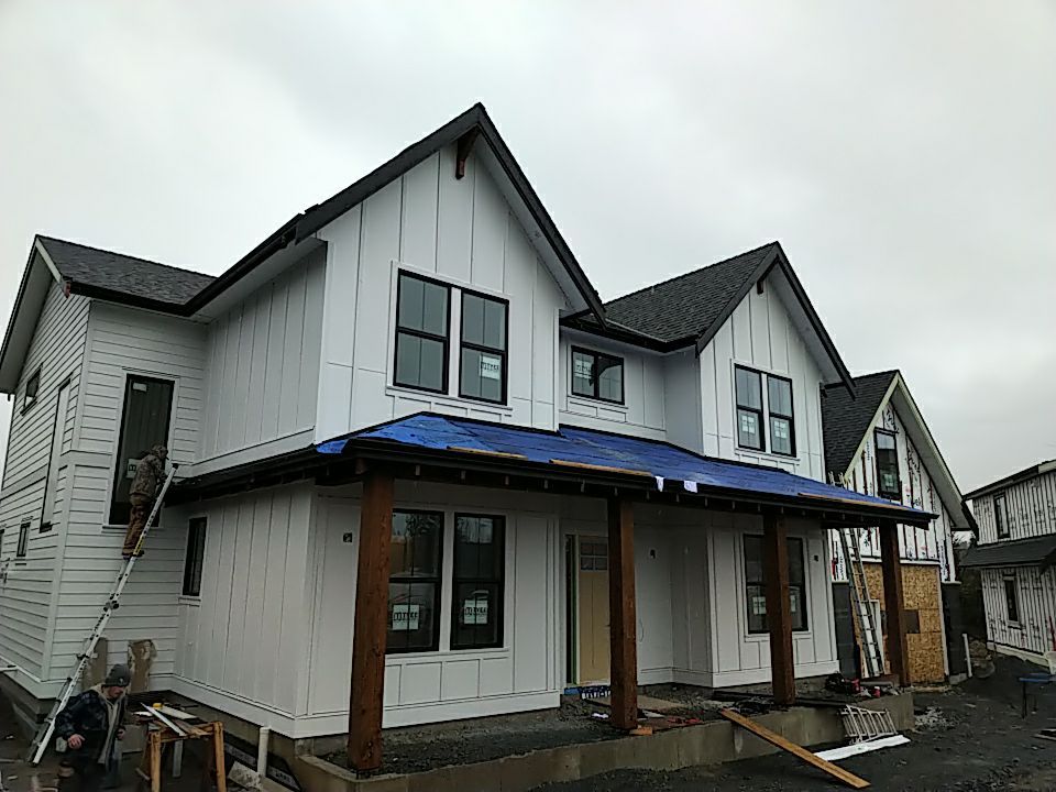 Residential Roofing Installation using OC Oakridge shingles with prolok accent roofs by Top Notch Roofing Inc