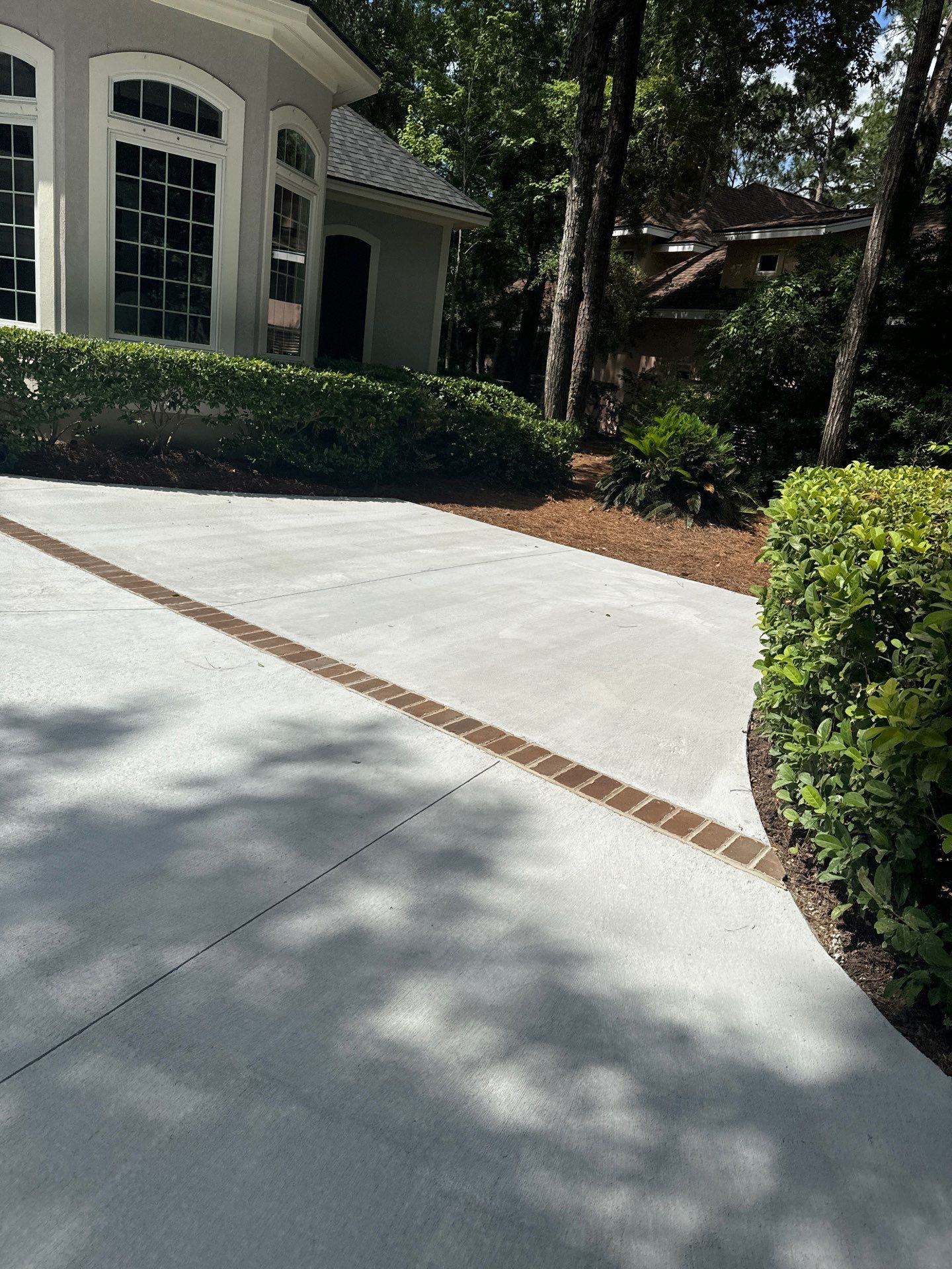 Hilton Head Island Concrete Driveway Replacement with Herringbone Brick Inlays by Lowcountry Scapes, LLC