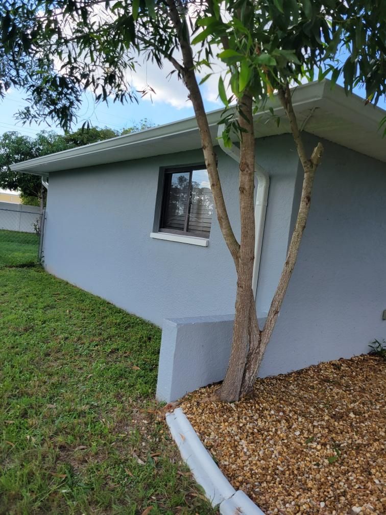 New Gutter System with Splash Guards in Cape Coral FL by Gutter Professors