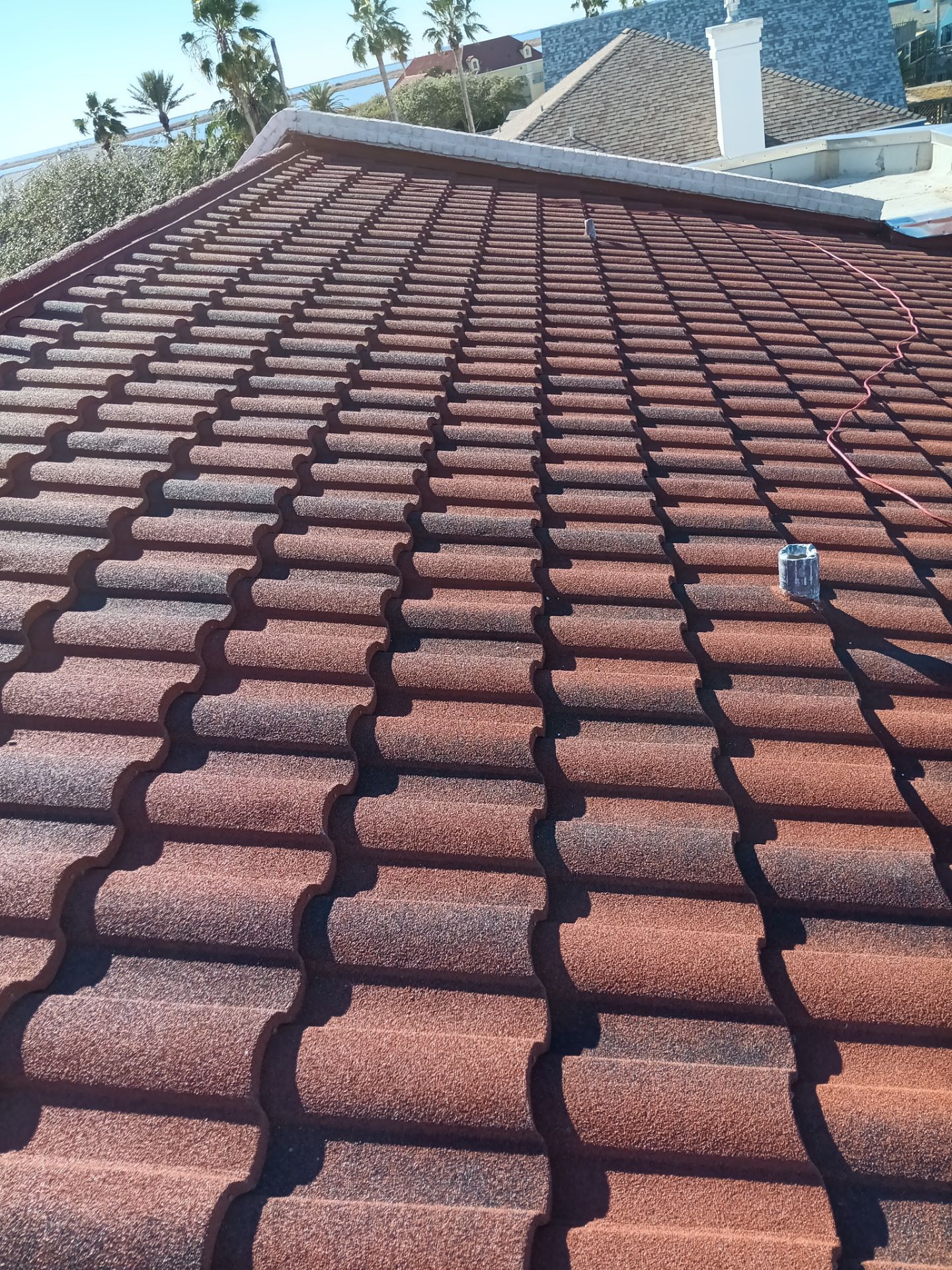 Off with the Tile and on with the TILCOR stone coated metal.  by Bayfront Roofing and Construction