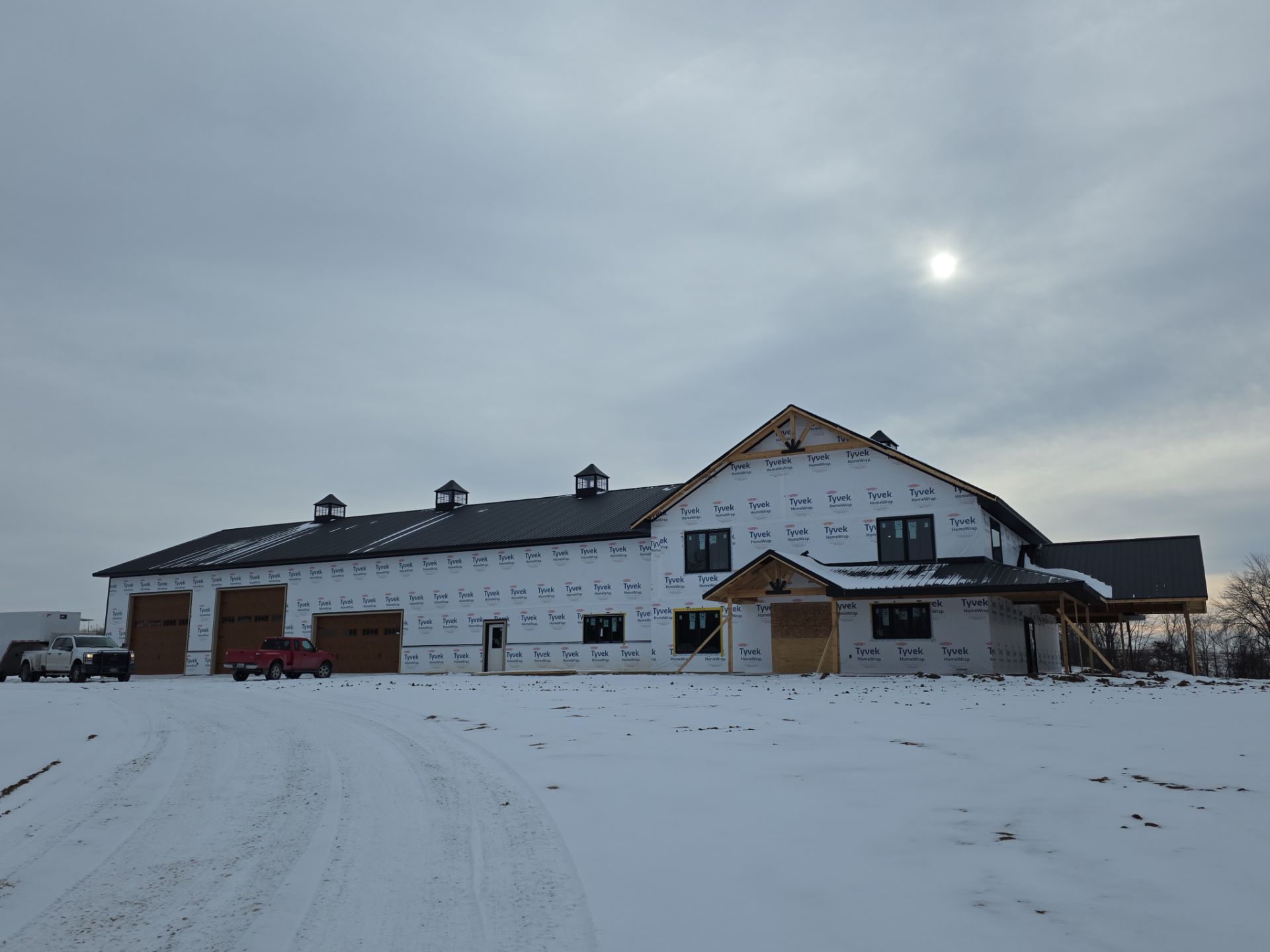 New Home construction w/ board and batten sides and metal roof  by Miles Construction 